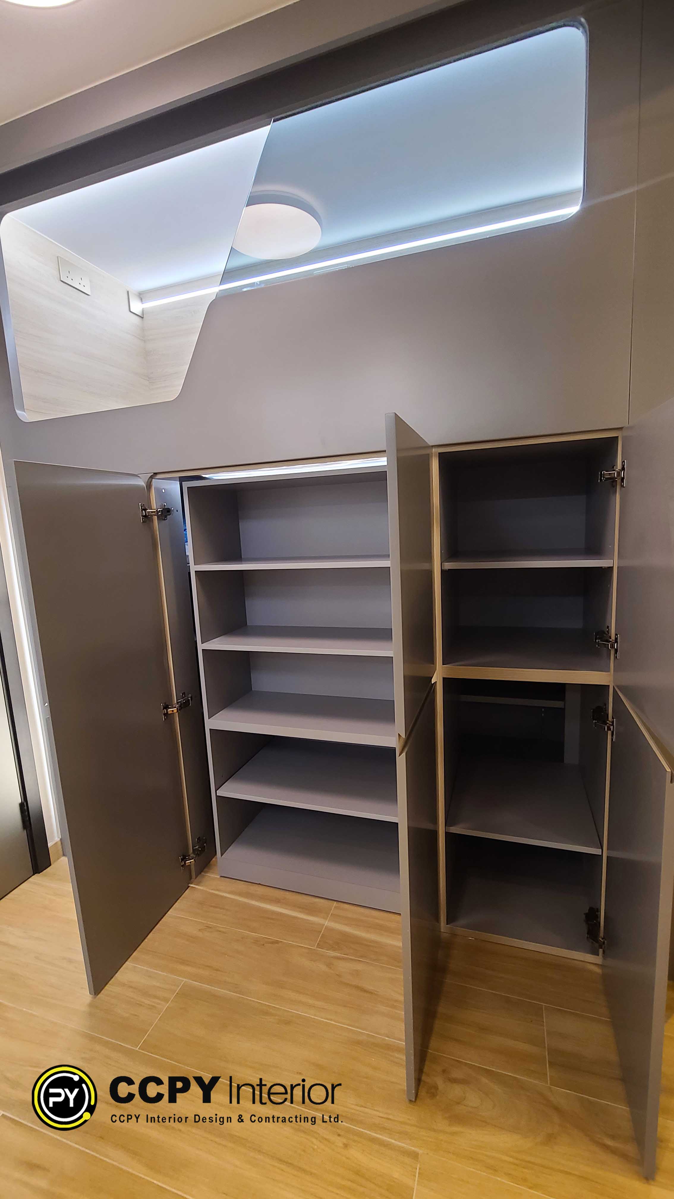 The image shows a custom built-in storage unit as part of the interior renovation portfolio for the Pok Yat House at Pok Hong Estate, Sha Tin, Hong Kong