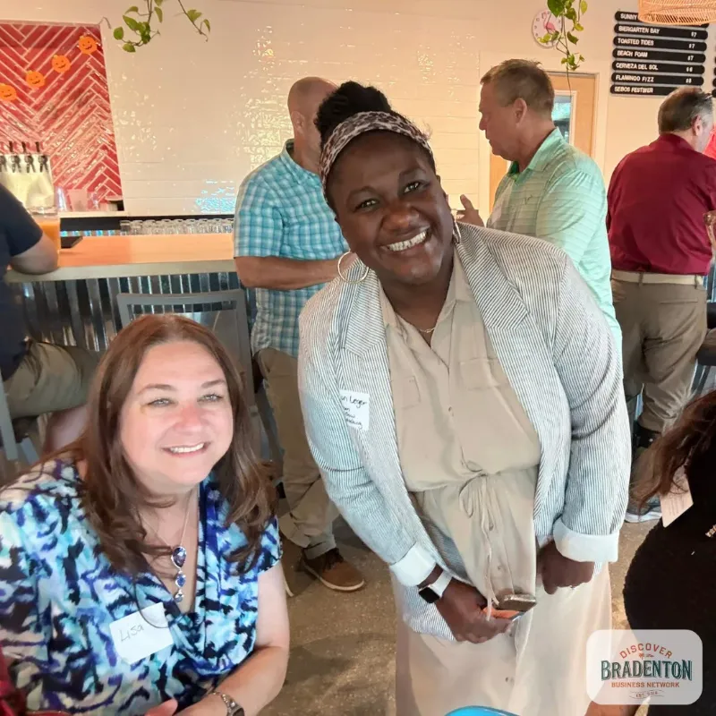 2 smiling people seated bradenton