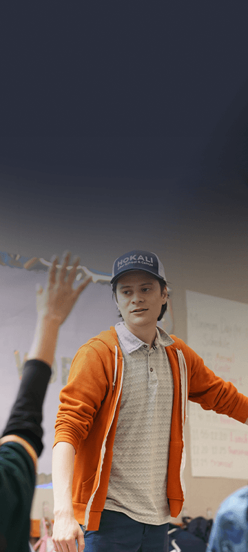 HOKALI instructor leading an engaging classroom activity with elementary students during an after-school enrichment program