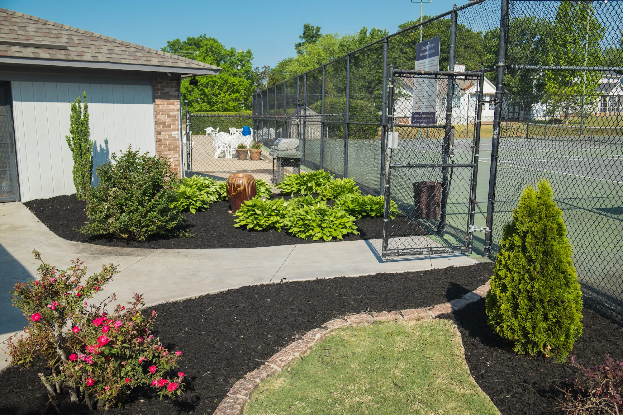 Fresh mulch installation around flower beds and landscaping