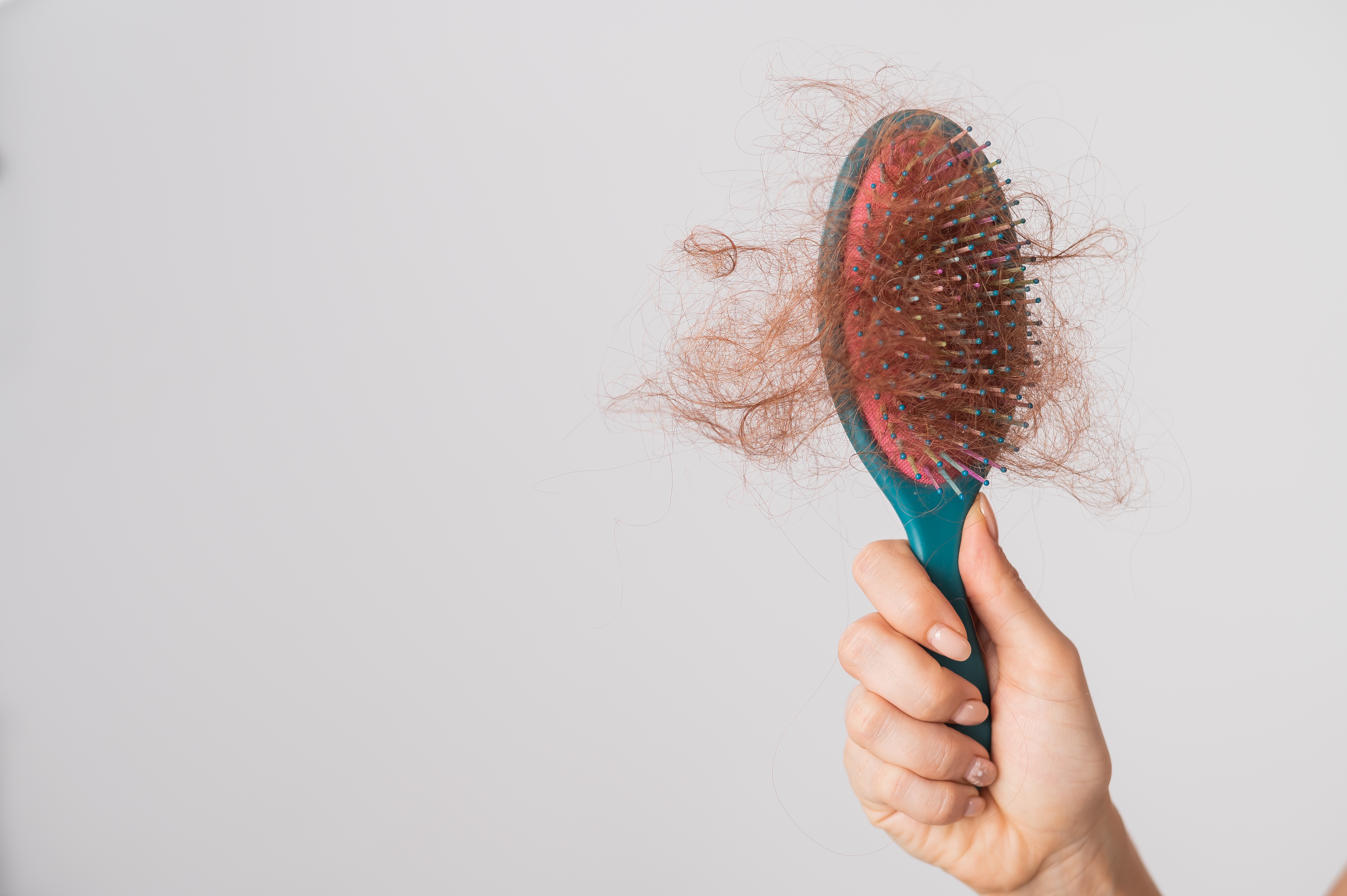 What Hair + Me Doctors Wish You Knew About Hair Shedding