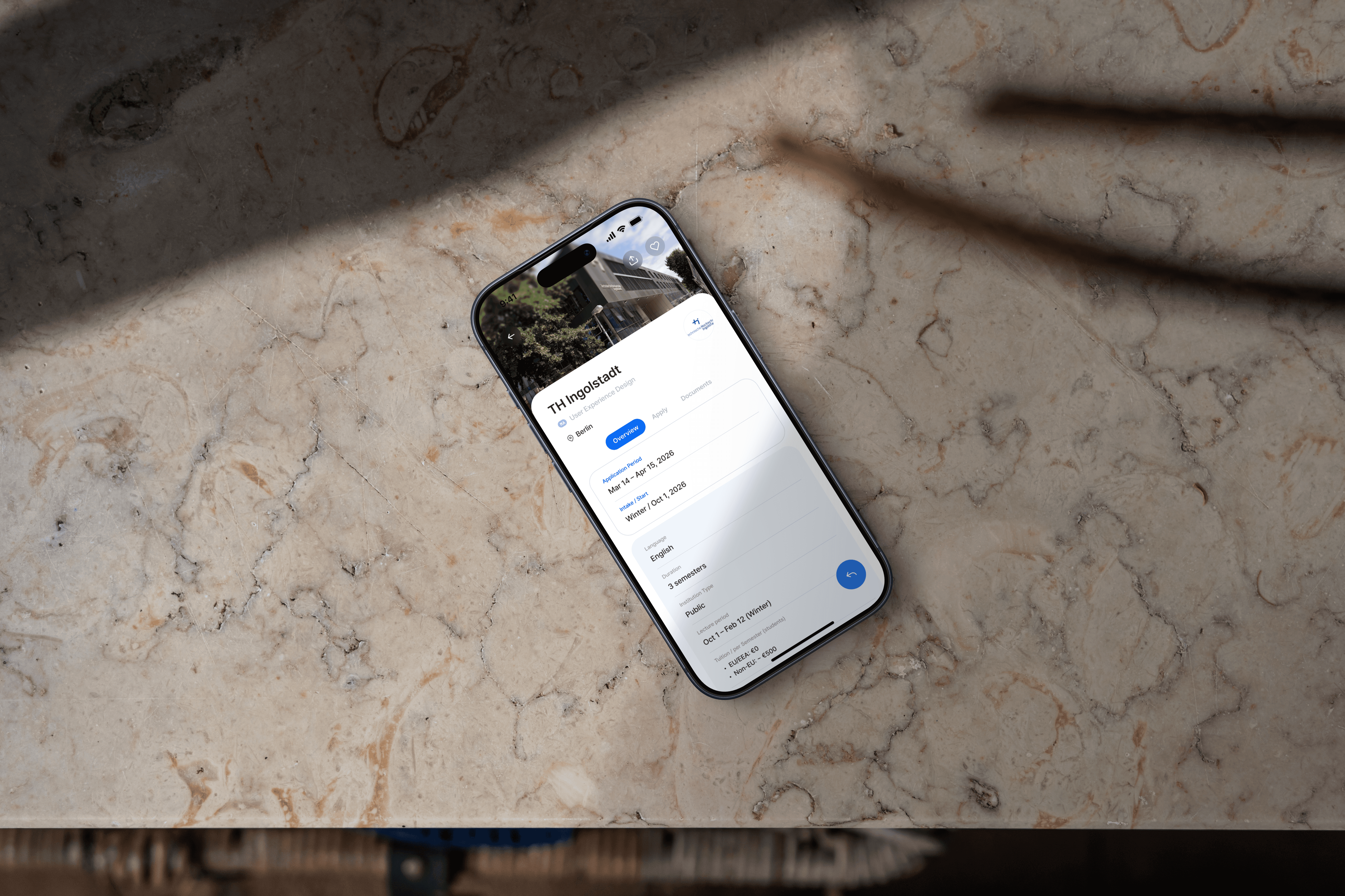 Train at a sunny station platform.