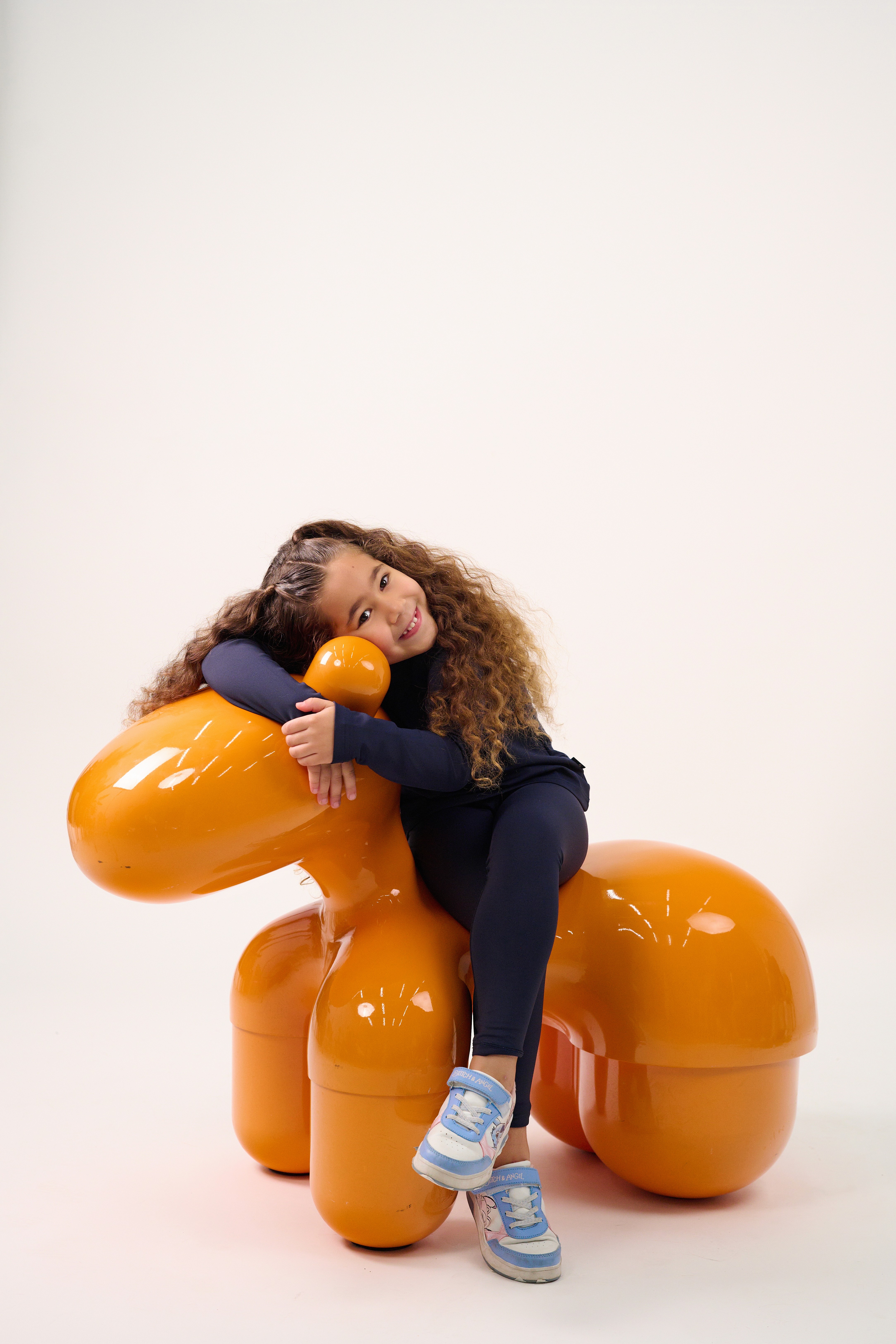 Friends laughing and posing inside a car