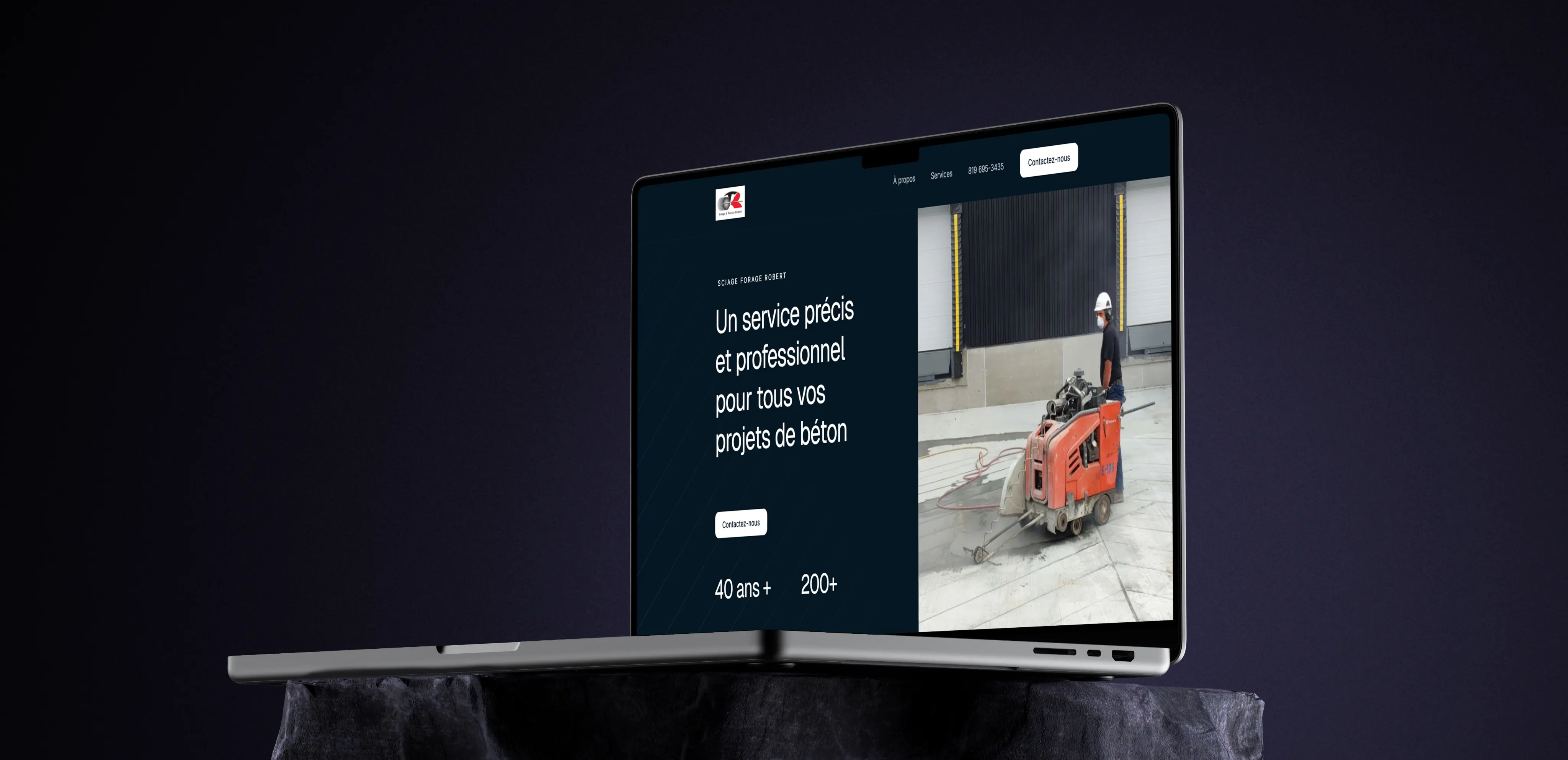 Mockup du site web de Sciage & Forage Robert affiché sur ordinateur portable — page d'accueil avec 40 ans d'expérience et plus de 200 clients