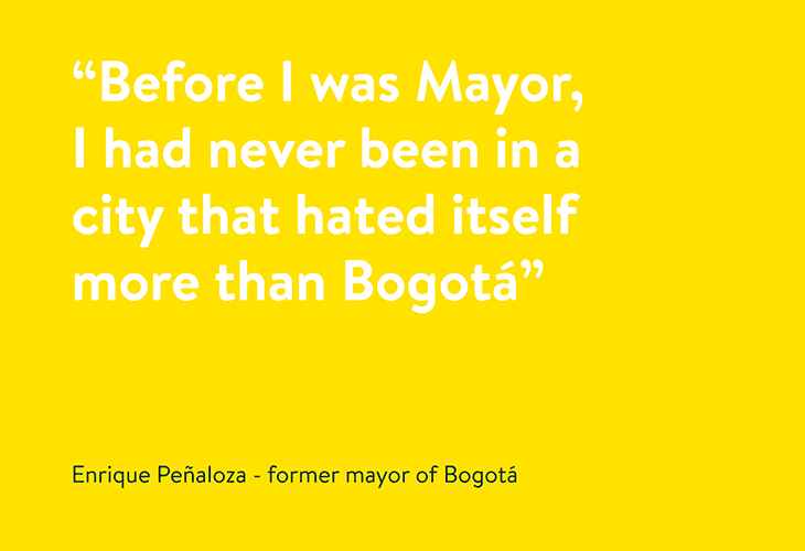 A quote on a bright yellow background reads, “Before I was Mayor, I had never been in a city that hated itself more than Bogotá.” Below the quote, the text attributes the quote to Enrique Peñaloza — former mayor of Bogotá.