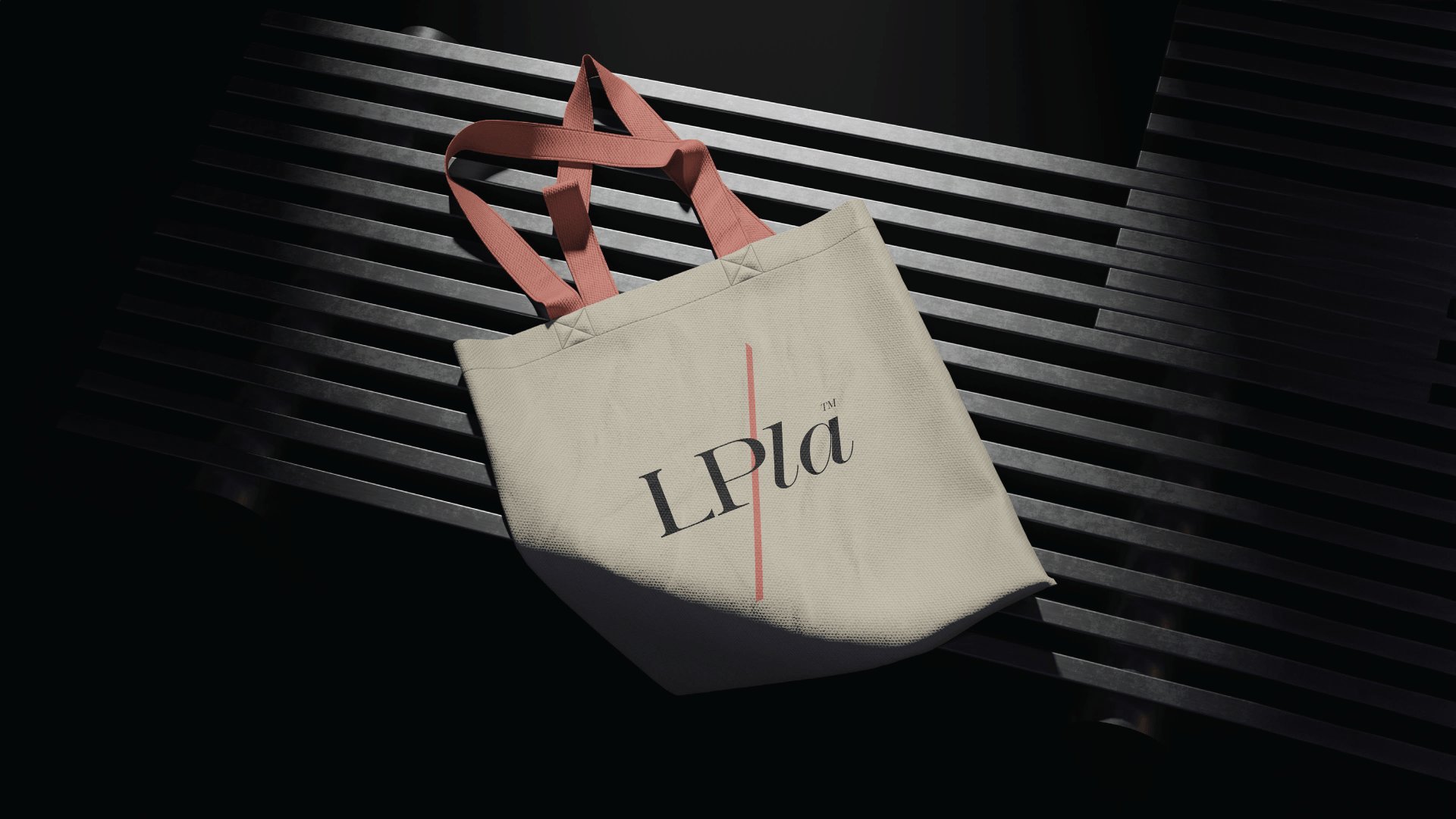 Canvas LPLA tote bag with coral handles in dramatic light