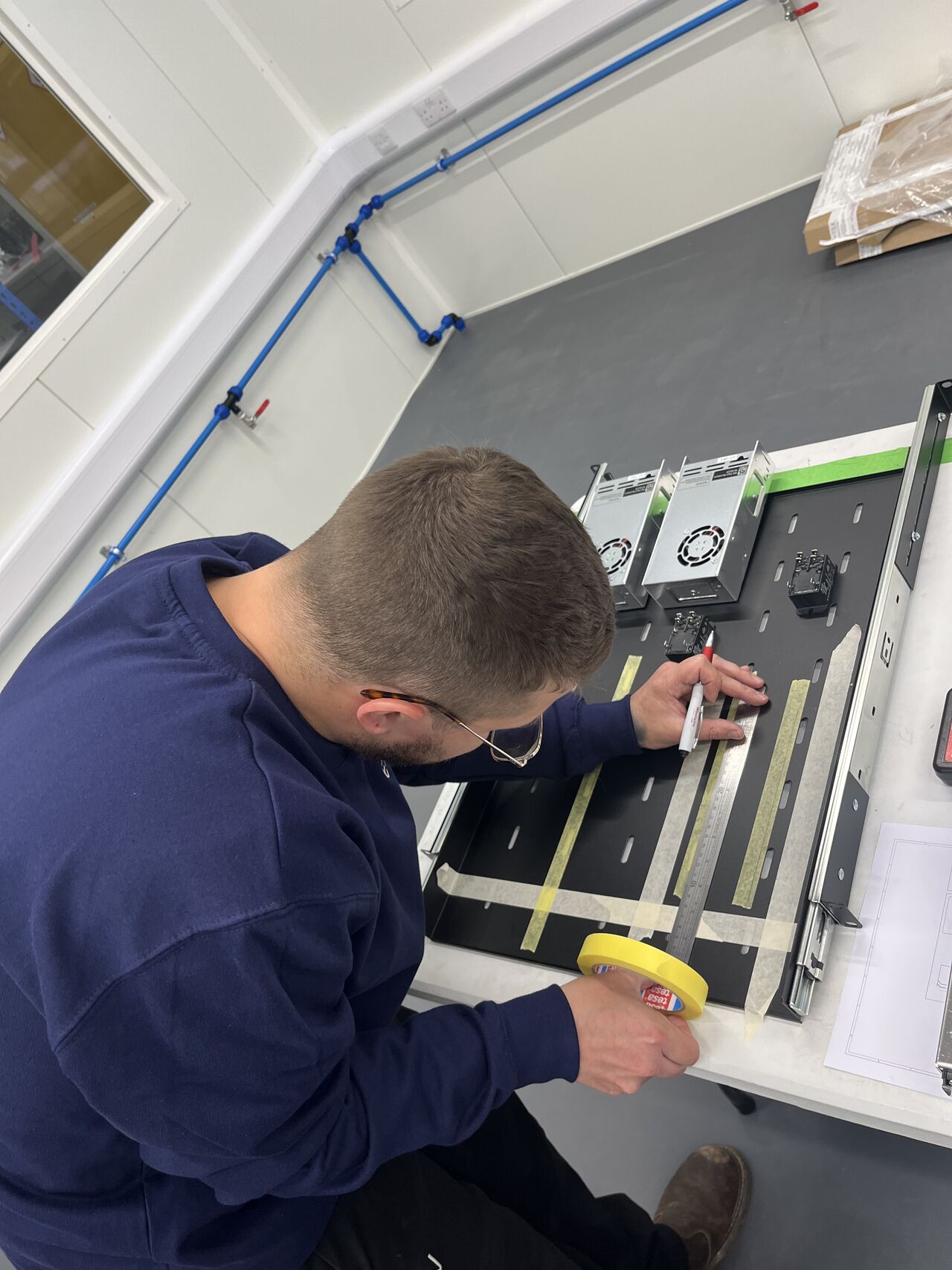 a yellow robot sitting on top of a table