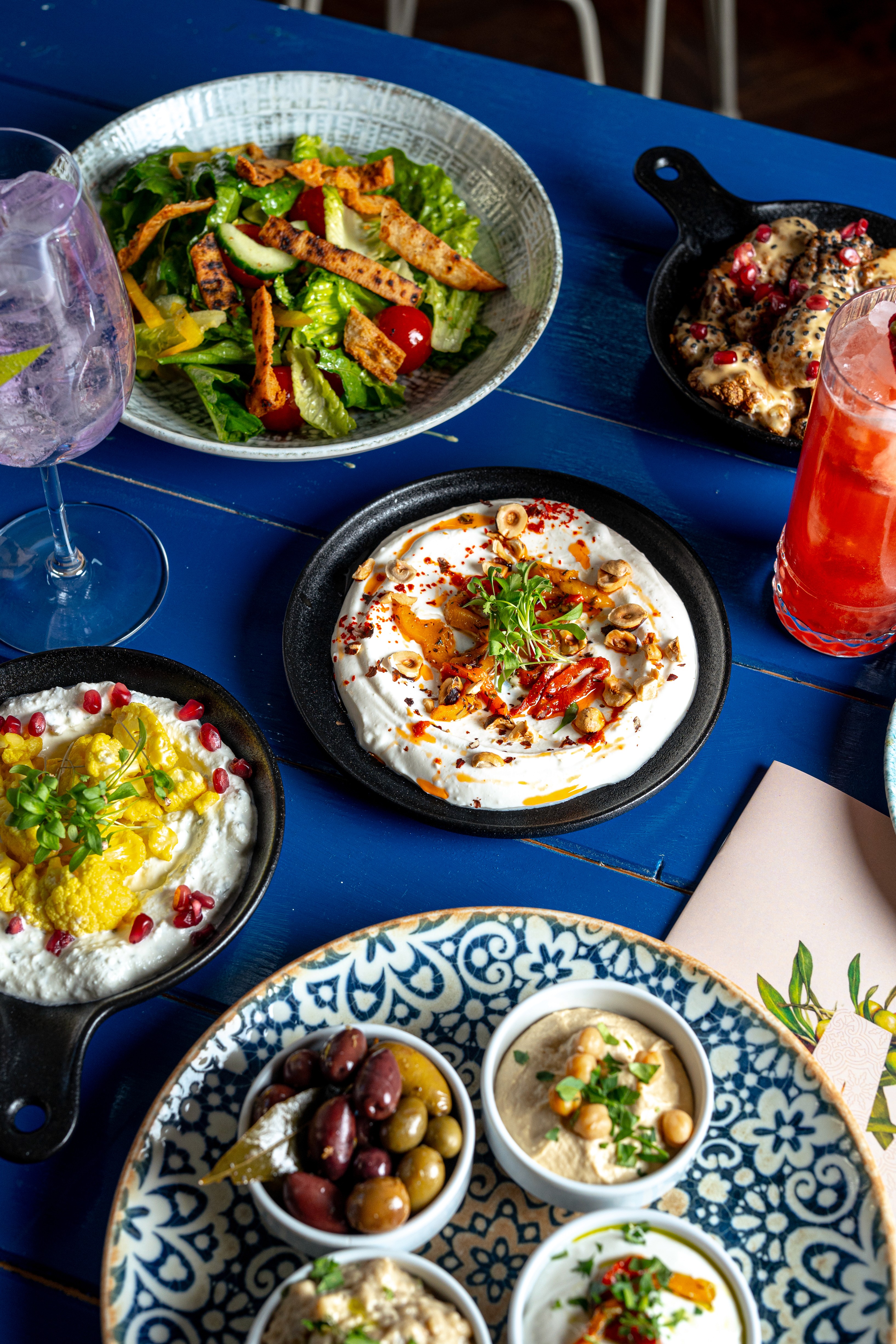 Colorful mezze platter with hummus and vegetables