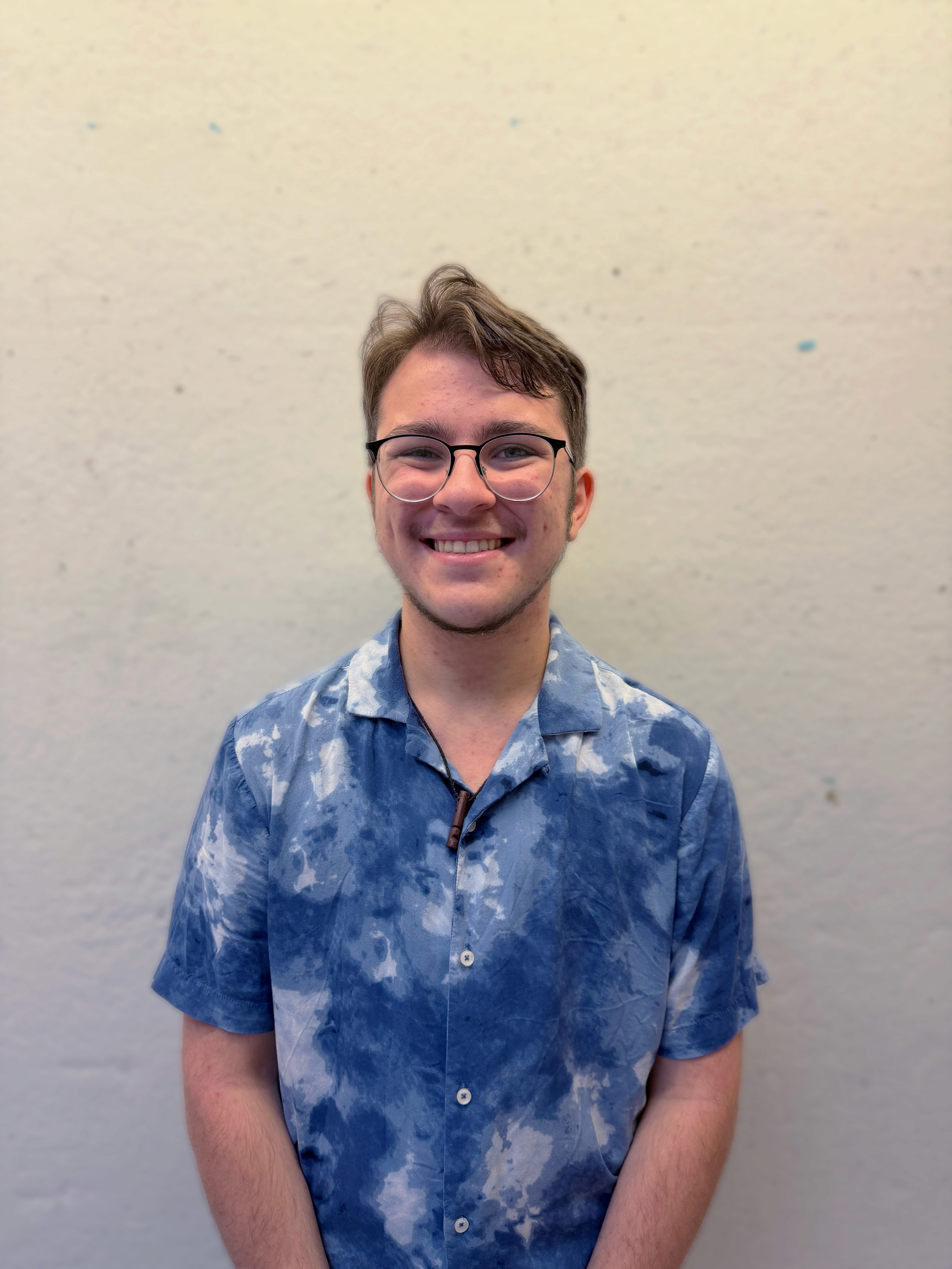 Headshot of Parker Fitz smiling at the camera