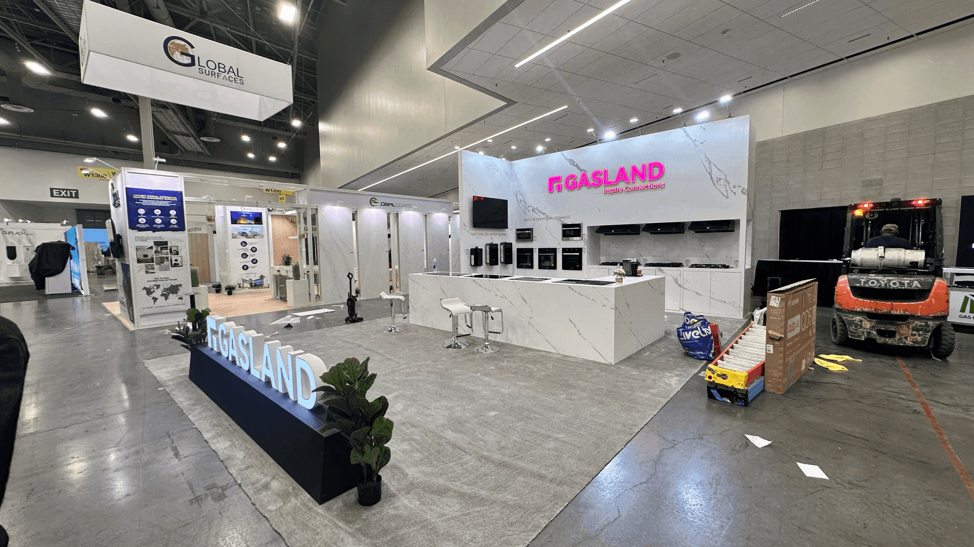 kitchen and bath exhibit booth with product installation mockup and material presentation zones