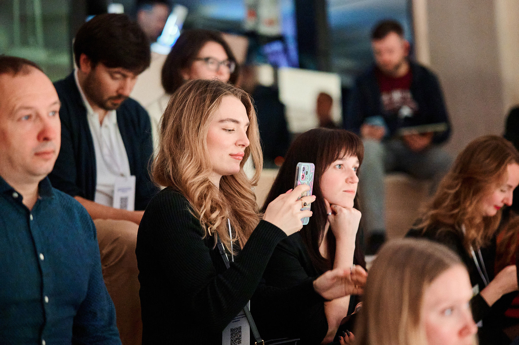 Panel discussion at an AI conference featuring experts in product, technology, and business.