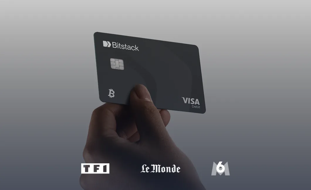 Bitstack Visa card held in hand, with TF1, Le Monde and M6 logos