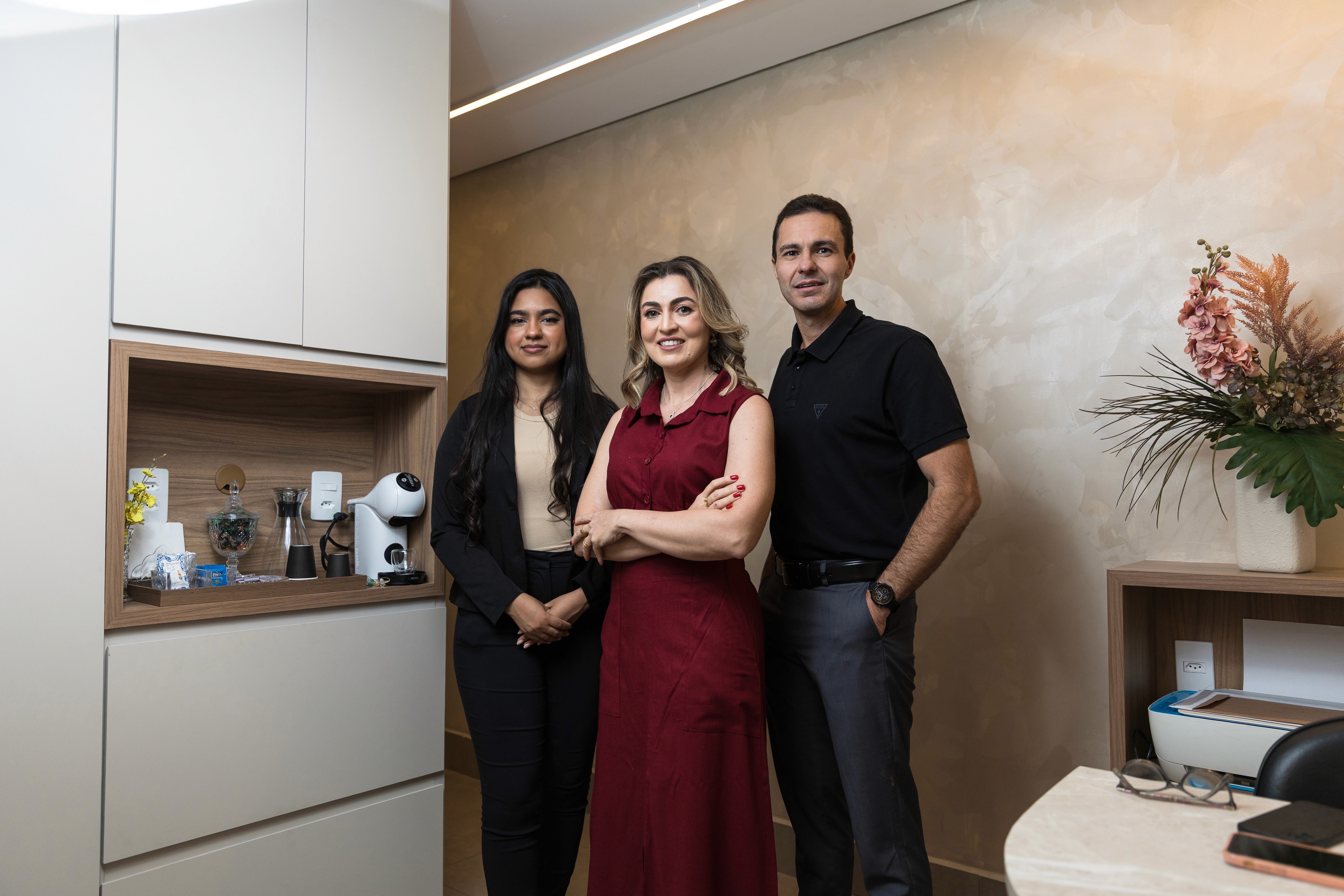 Three children jumping in burlap sacks during a race.