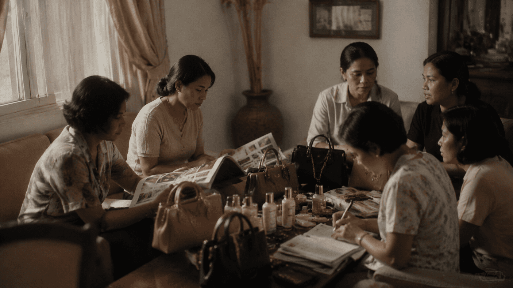 Sophie Martin members presenting catalogs, handbags and cosmetics at a home gathering in Indonesia