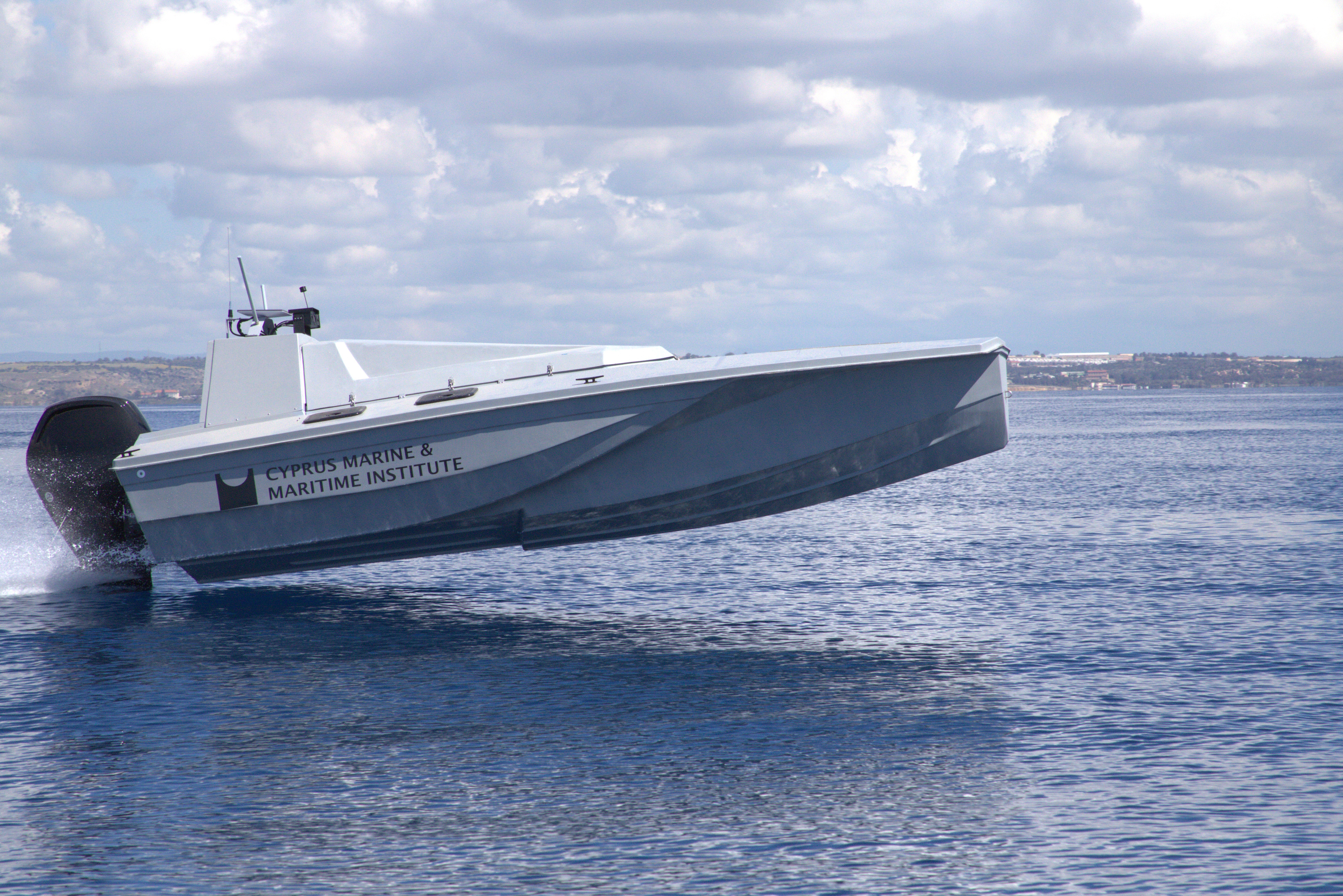 White luxury passenger boat on calm water