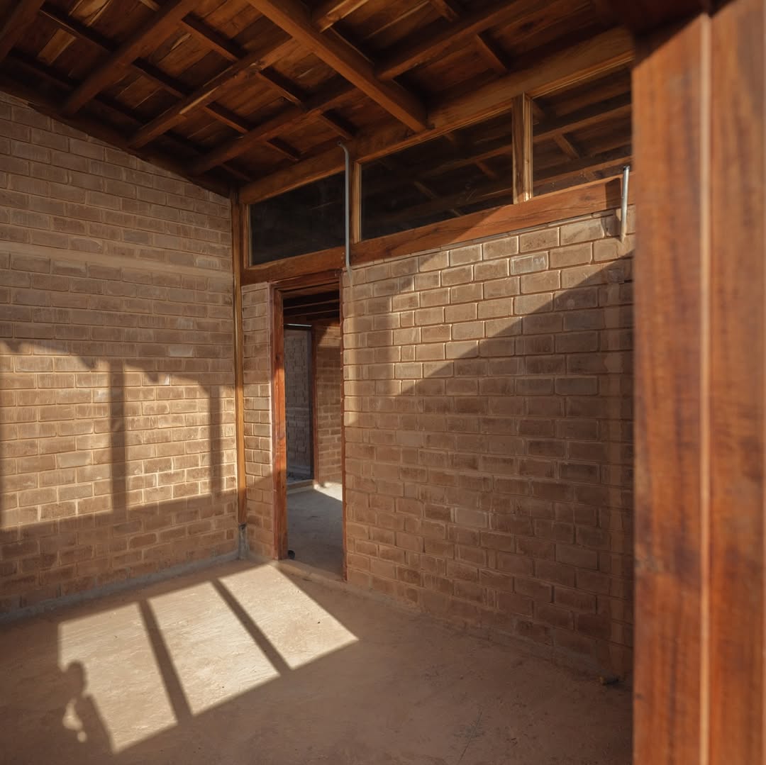 white concrete house near green tree during daytime
