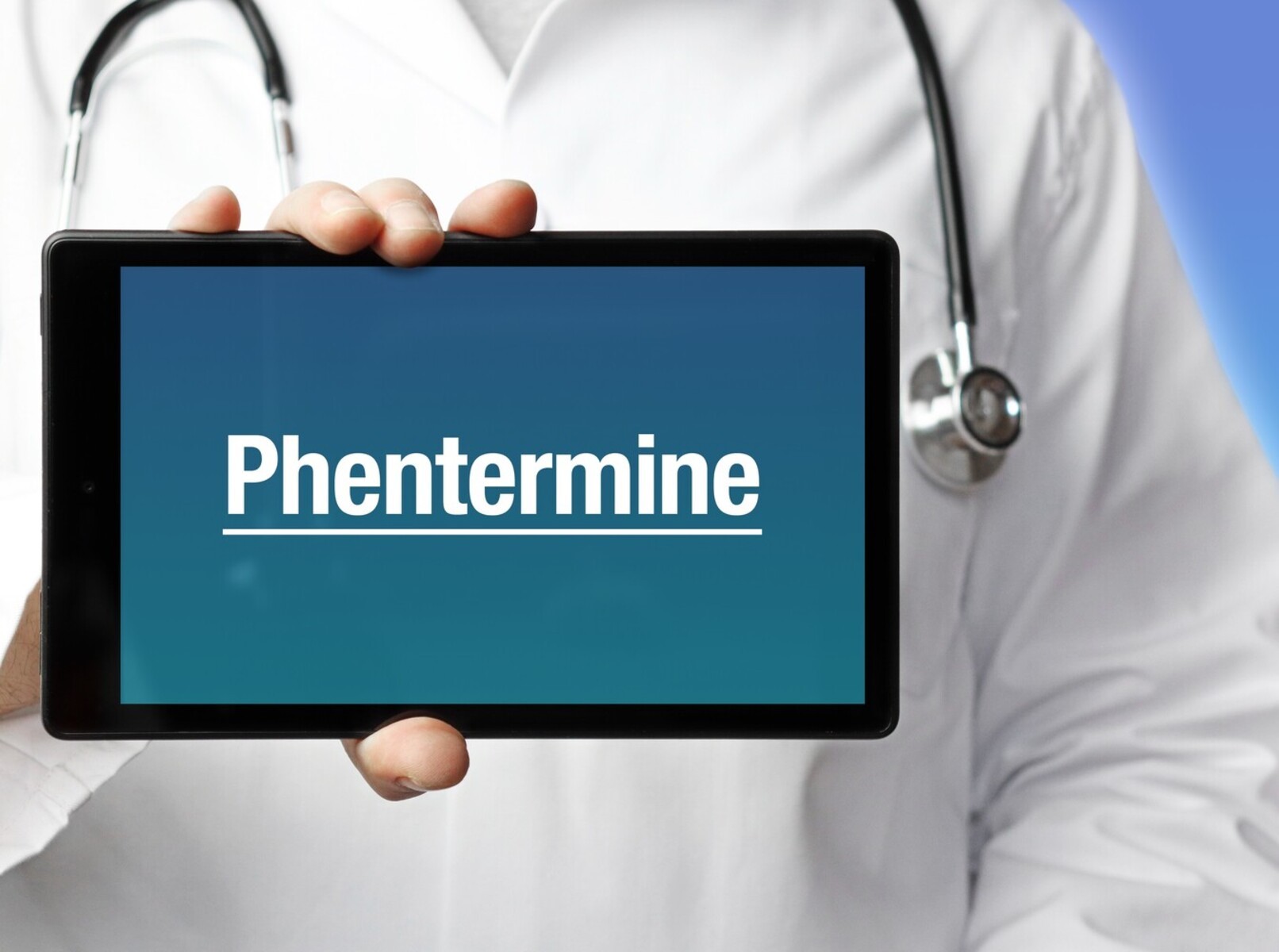 doctor showing phentermine on a tablet, showcasing weight loss prescriptions