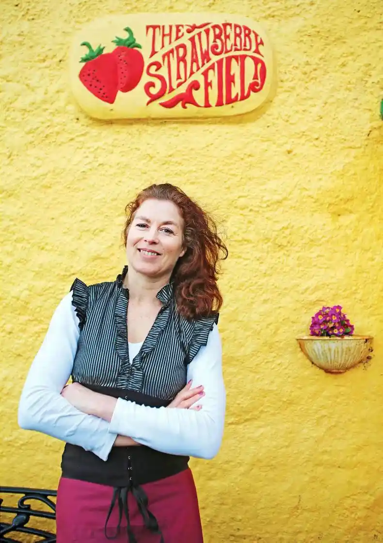 Margaret Kerssens standing infront of the Strawberryfield