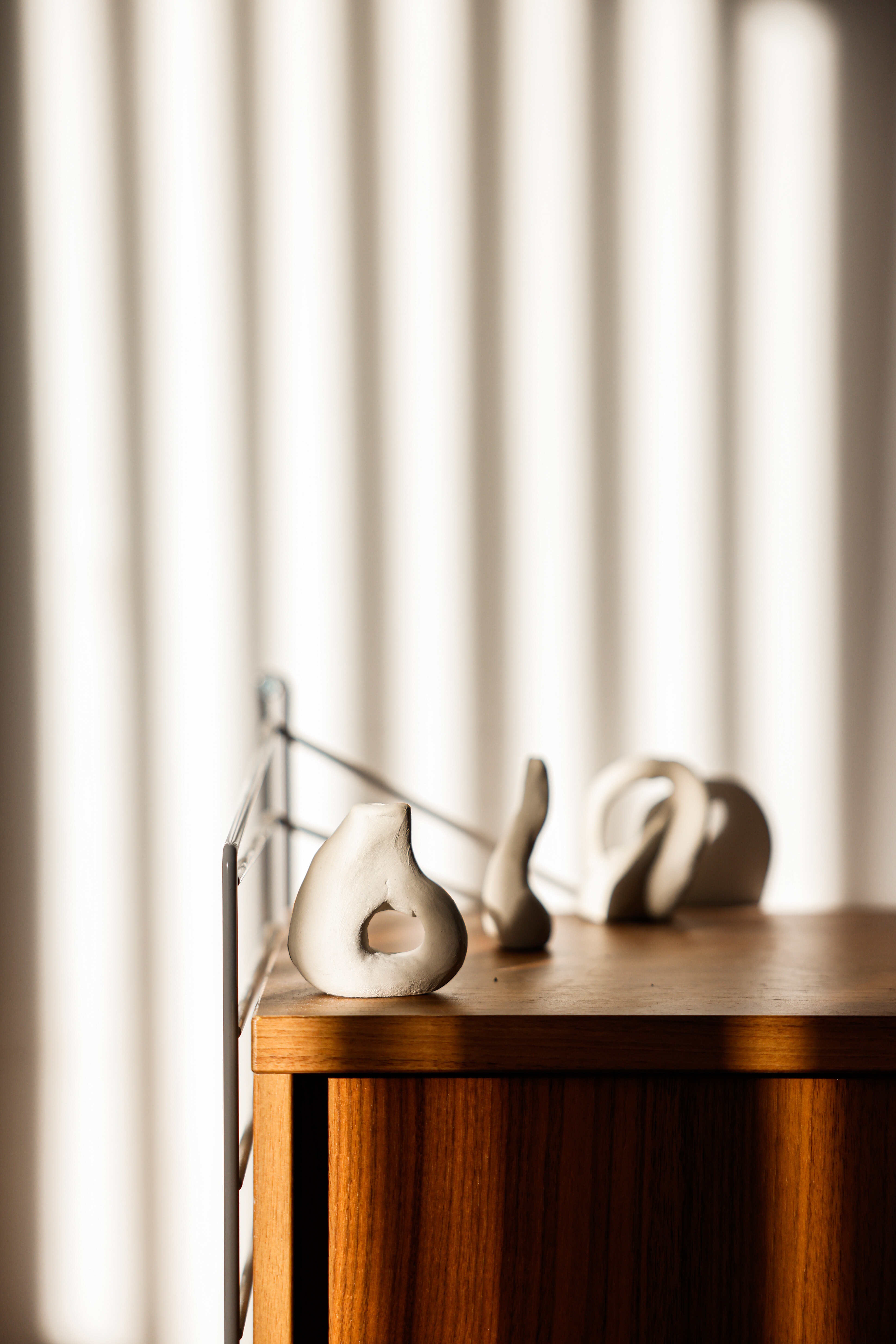 A scene of ceramic vases on top of a drawer