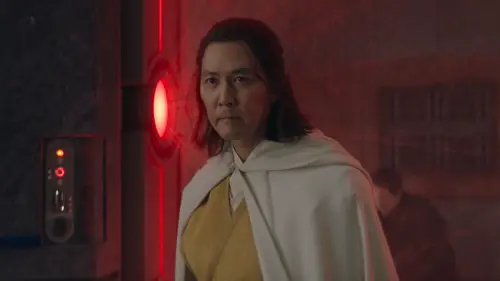 Master Sol in a white jedi robe with a red light in the background