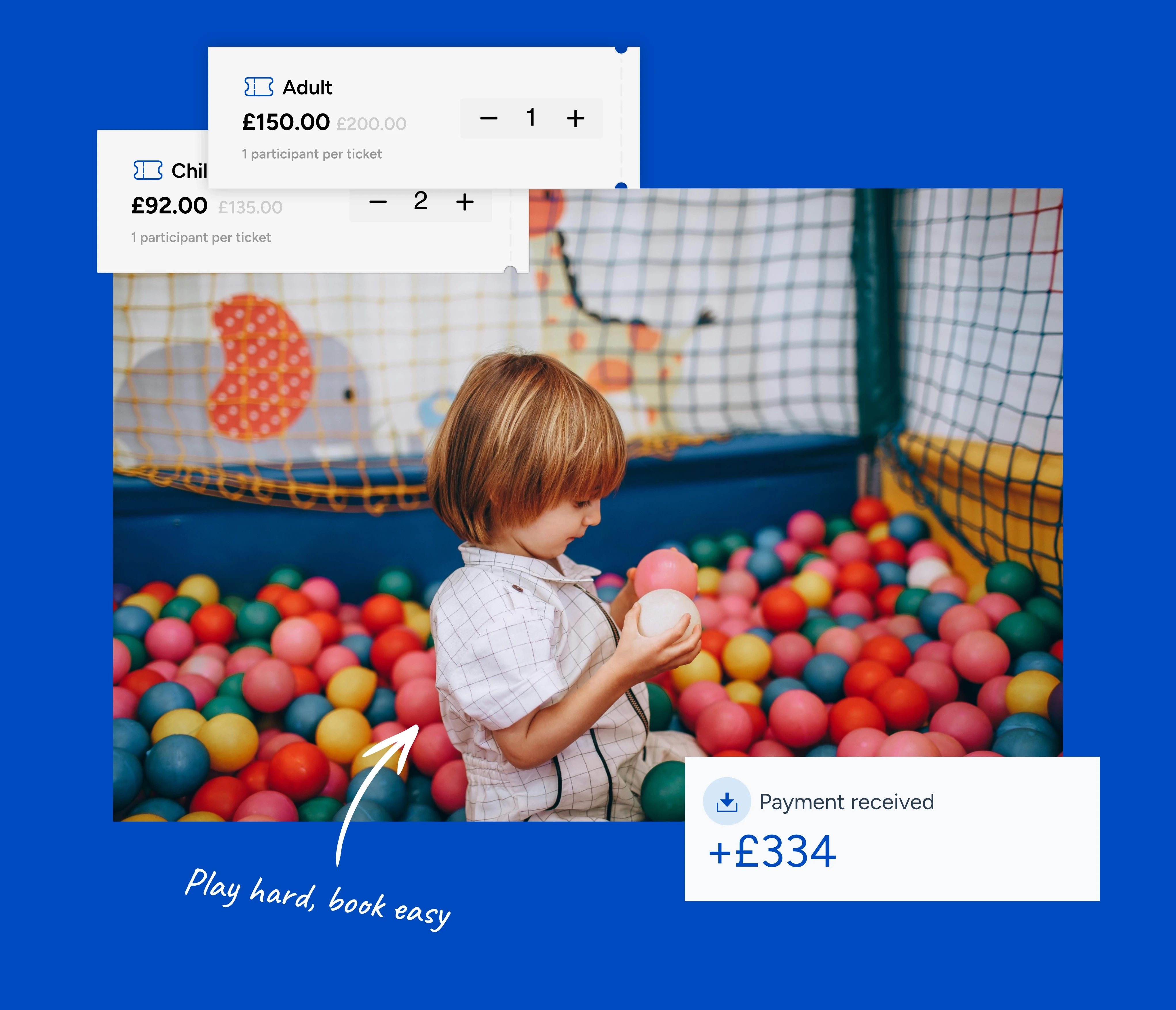 A child holds a white ball in a ball pool within a soft play centre