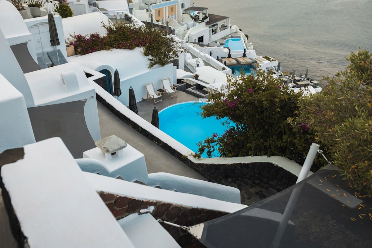 Cliffside blue pool hotels in Santorini