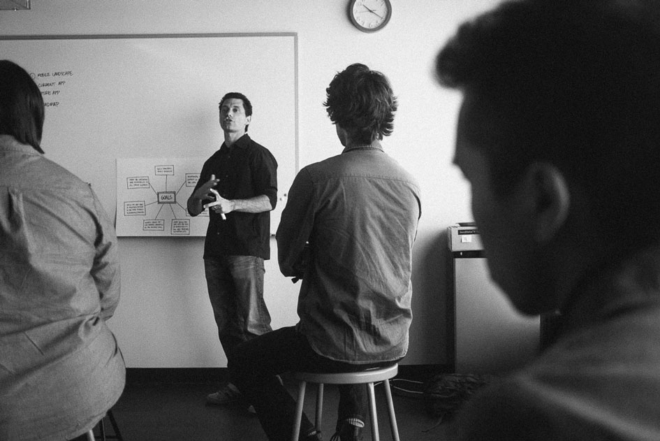 Jason presenting in a critique session about his work on Pinterest’s mobile navigation patterns.