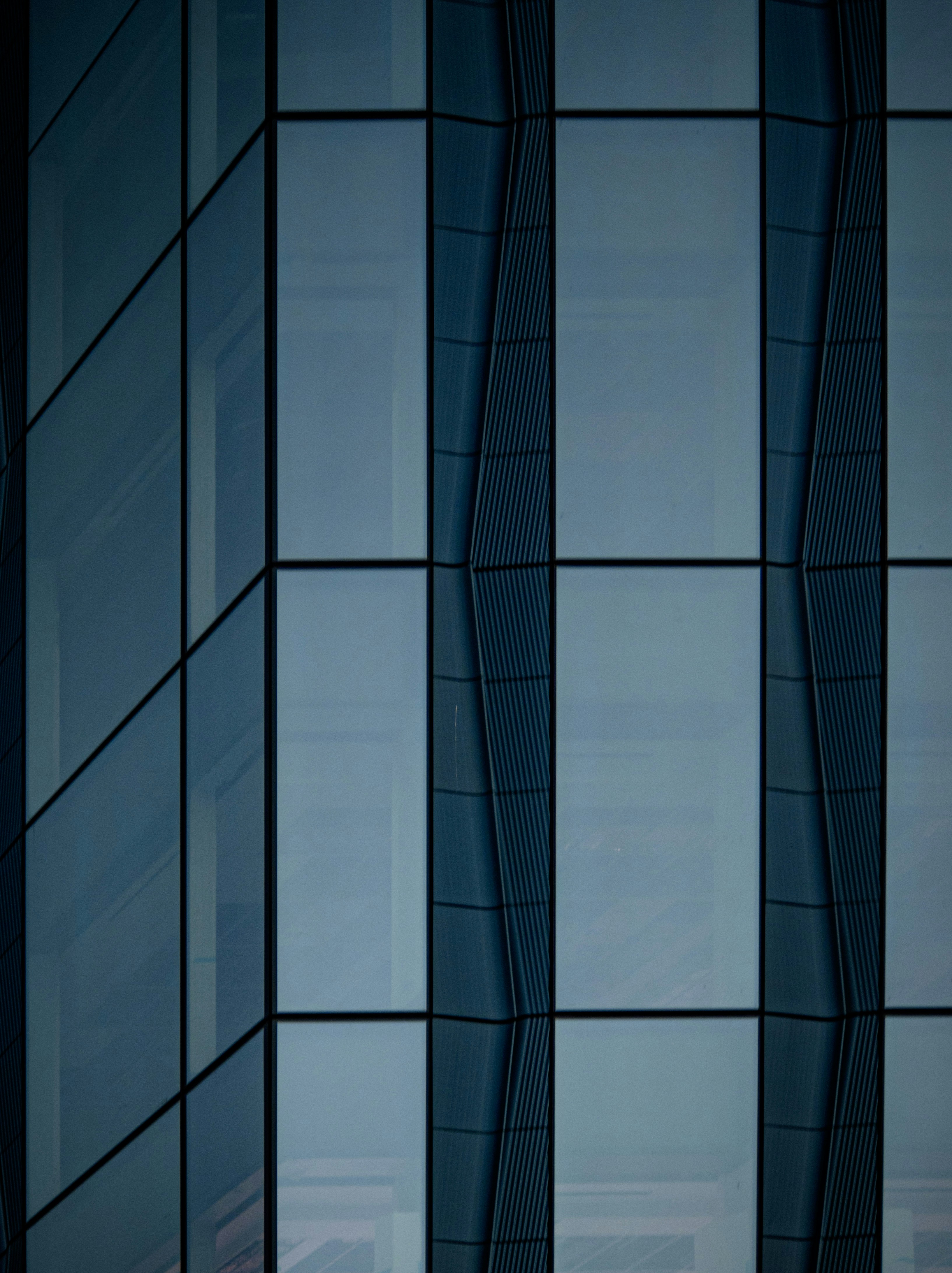 an airplane is flying in front of a building