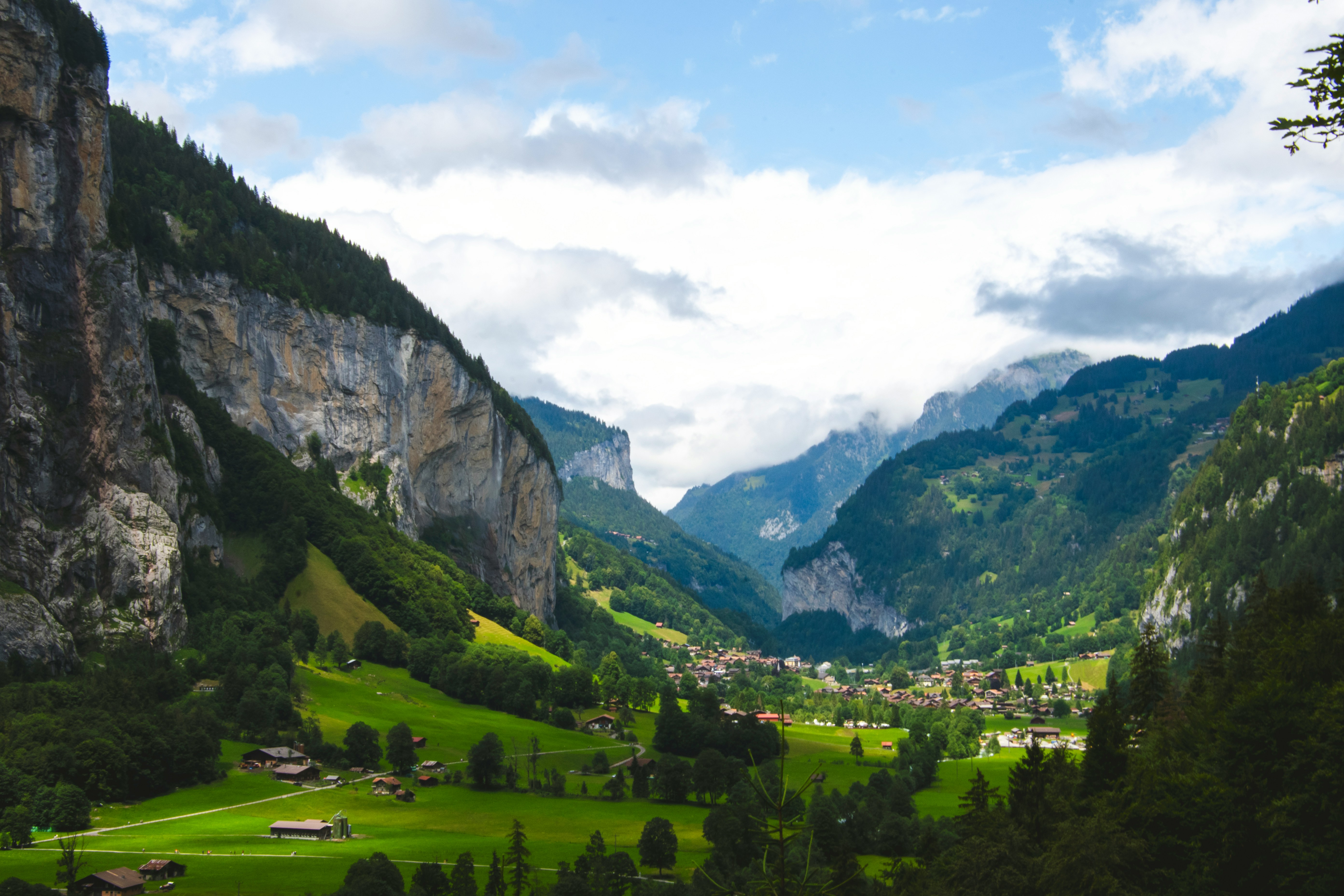 a valley with mountains in the background