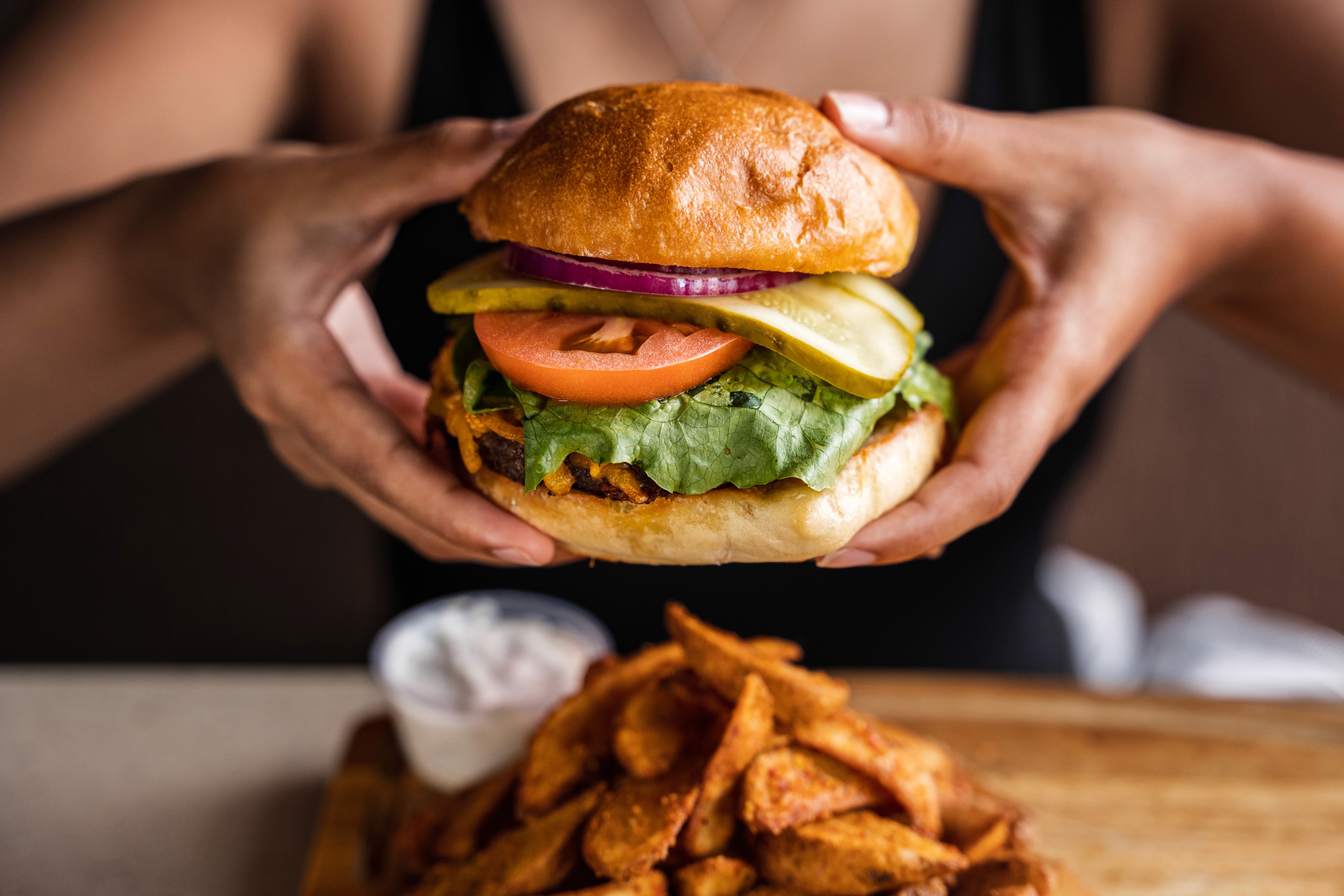 Streetside billboard with flyposters of the Batch.Works brand and illustrations