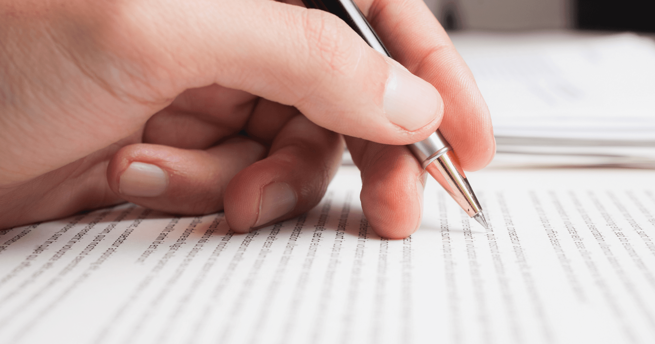A Malaysian business owner writing down on a paper
