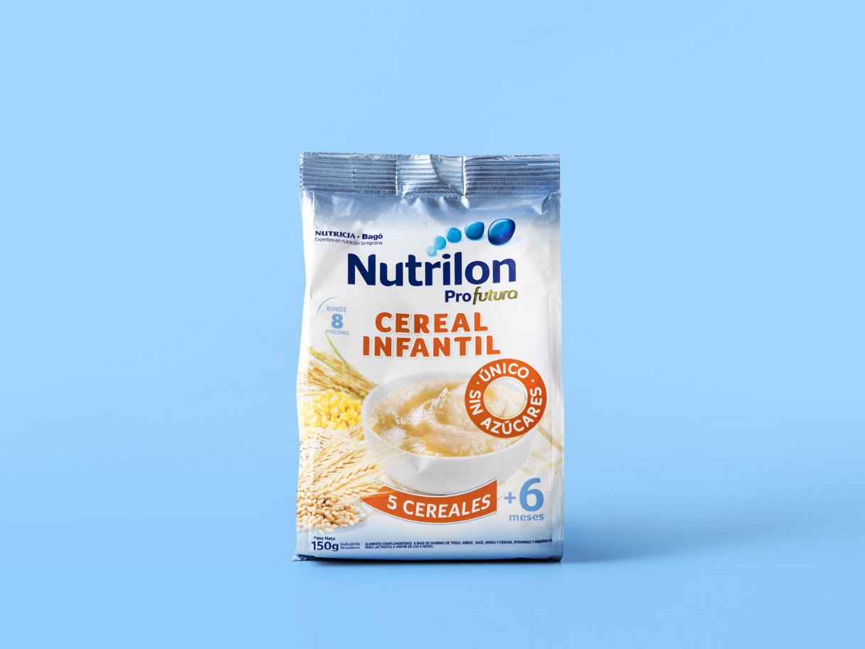 Rustic cabin in a golden field at sunset