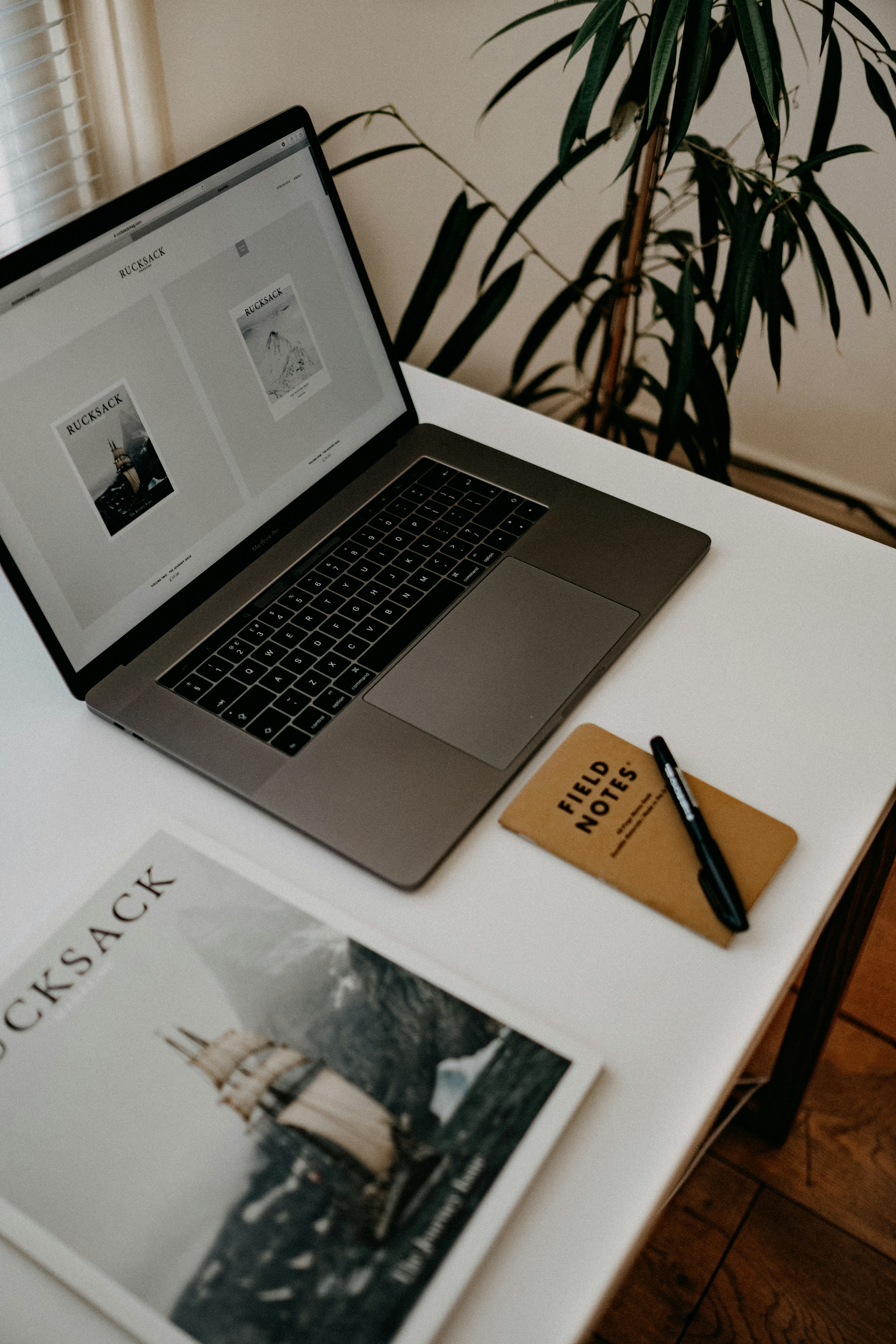 Magazine and laptop on a desk