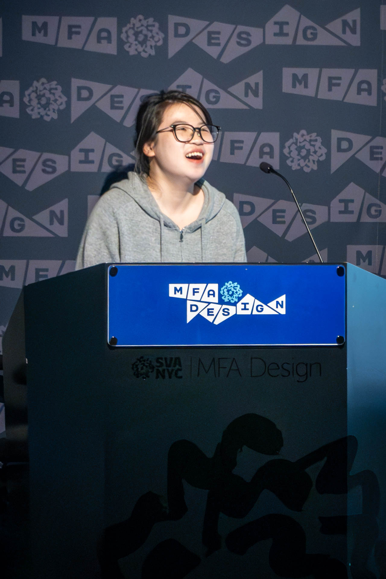 student at a podium giving a presentation