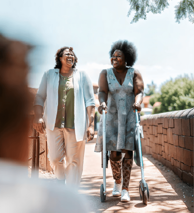 two older elderly woman walking together
