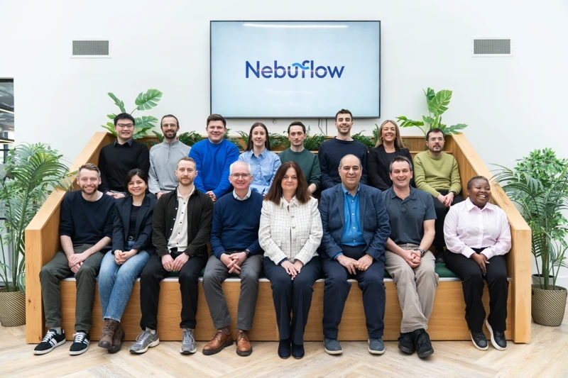 NebuFlow team sitting together in a modern office environment.