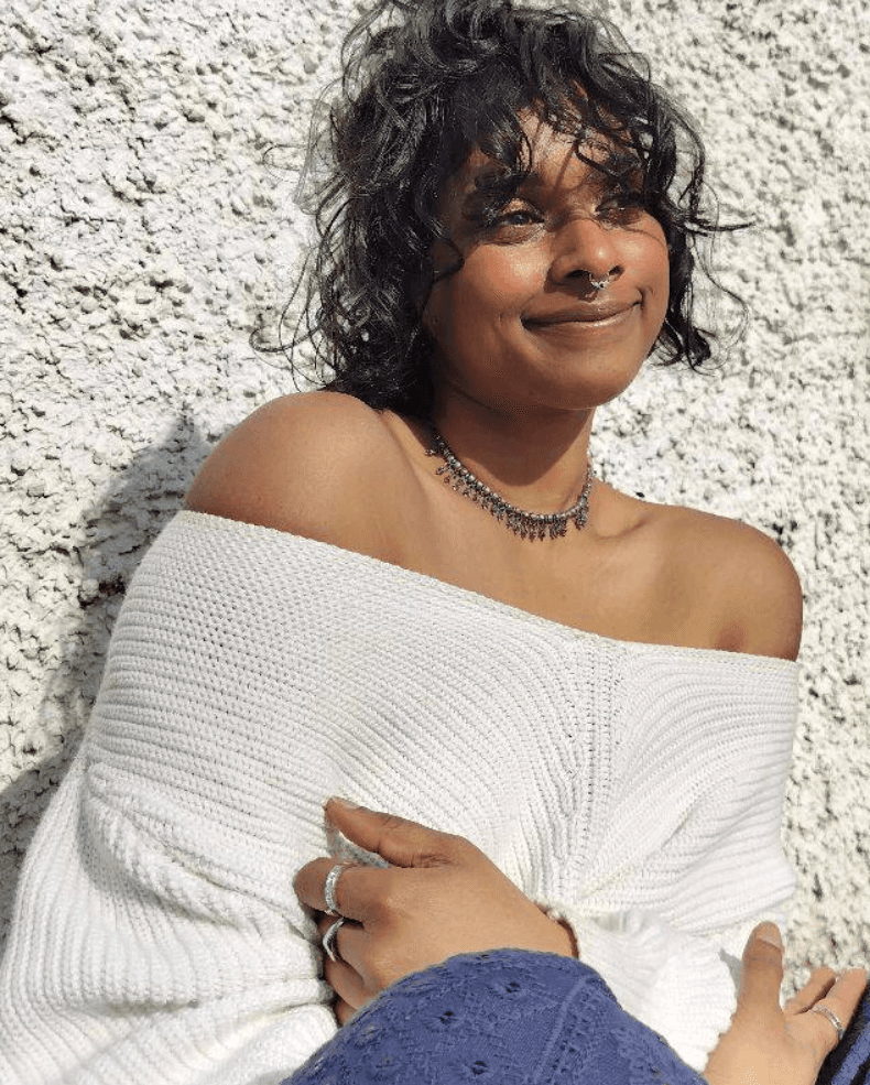 Black and white portrait of a man with a beard and glasses