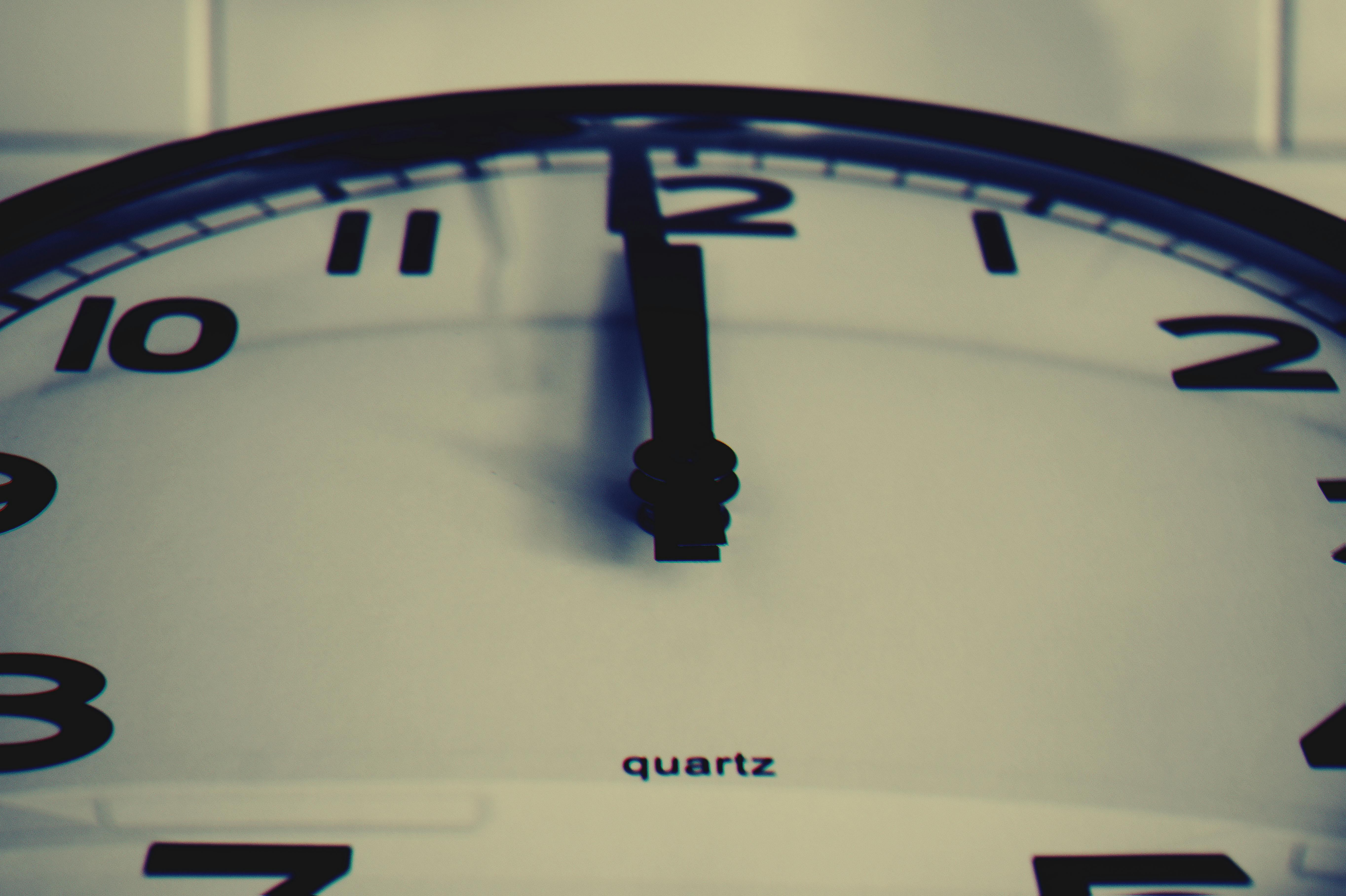 detailed-close-up-shot-of-a-wall-clock-showing-the-hour-hand-at-midnight,-highli - george-becker (pexels)