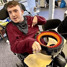 A man standing with Sufboard