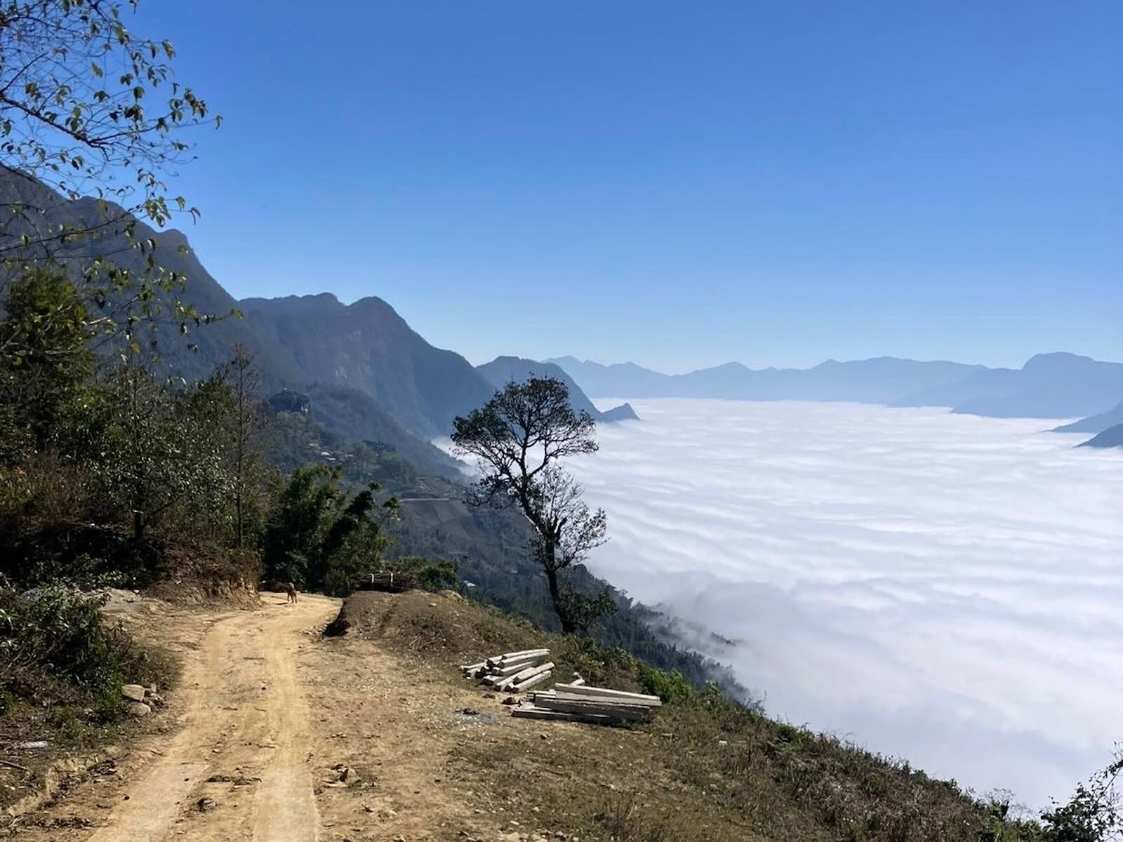 Mountain road overlooking cloud-covered valleys in Sapa northern Vietnam