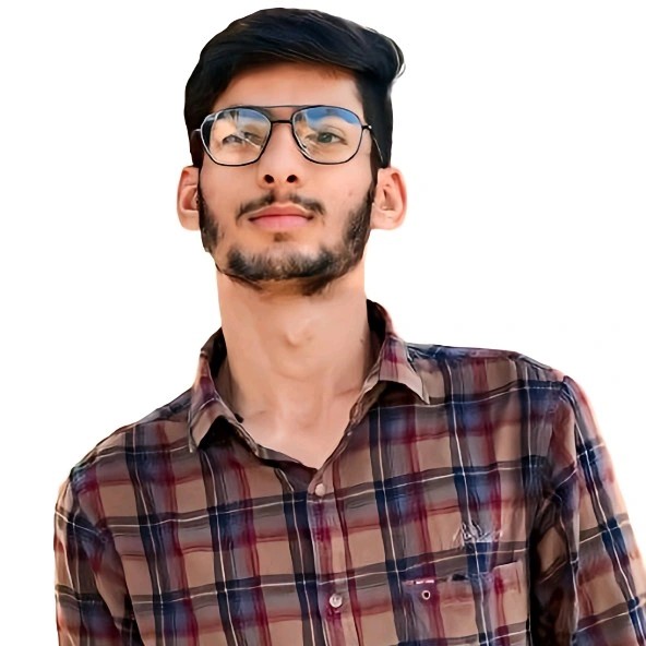 A person on a white shirt and black coat standing at the window indoor of the office