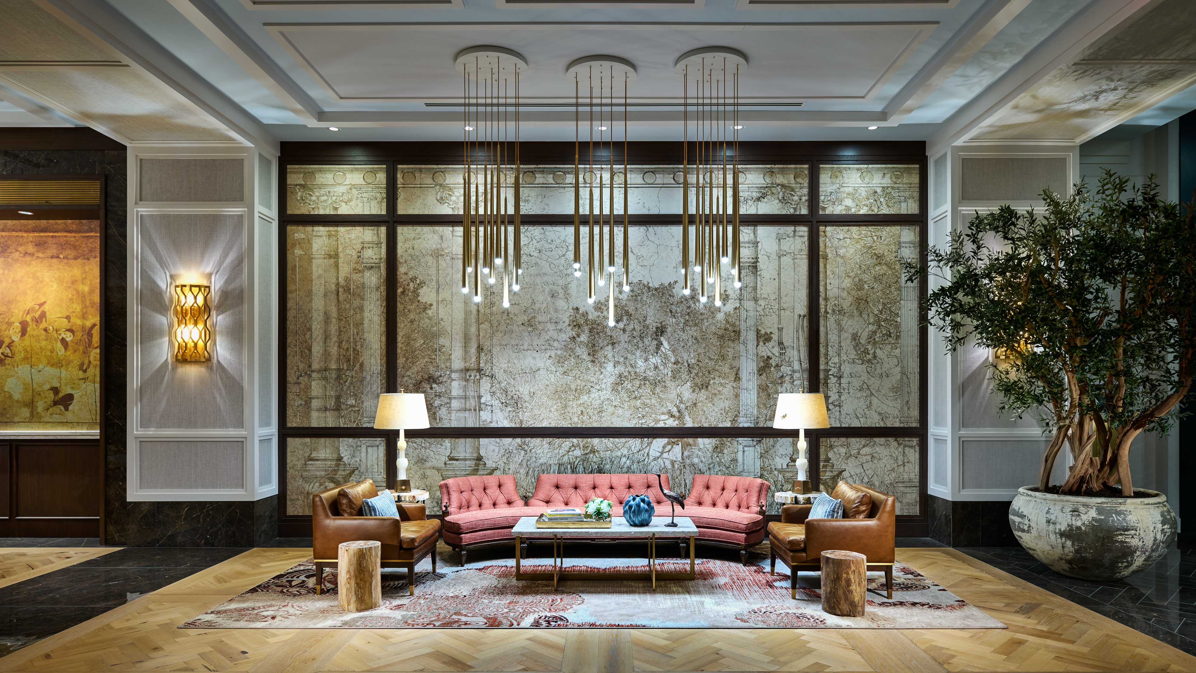 Lobby seating area with decorative wall and furniture.