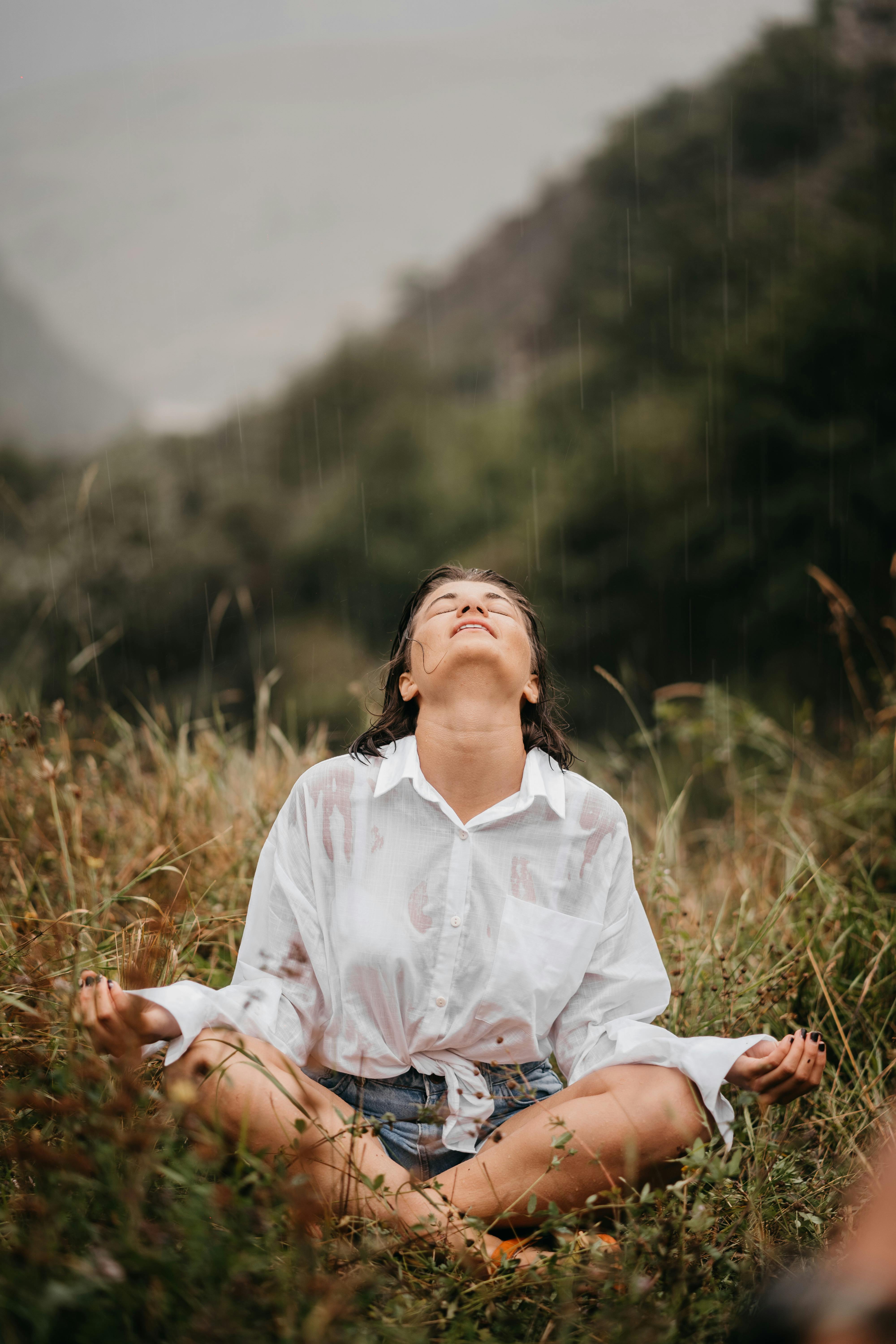 person sitting in a field