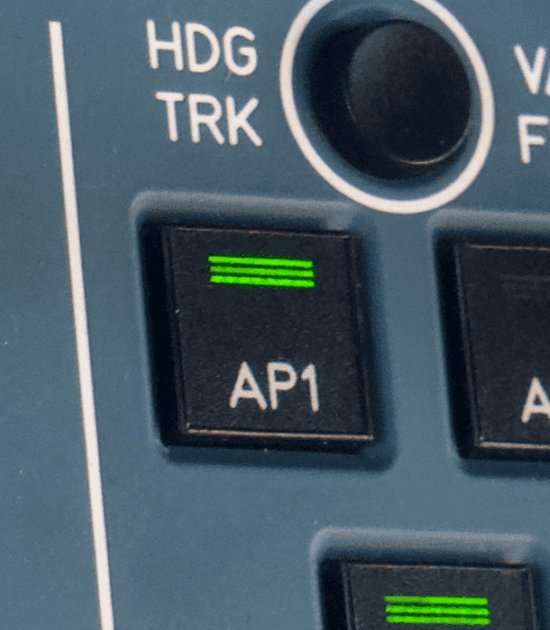 Ai3X - Photo of auto pilot button in cockpit