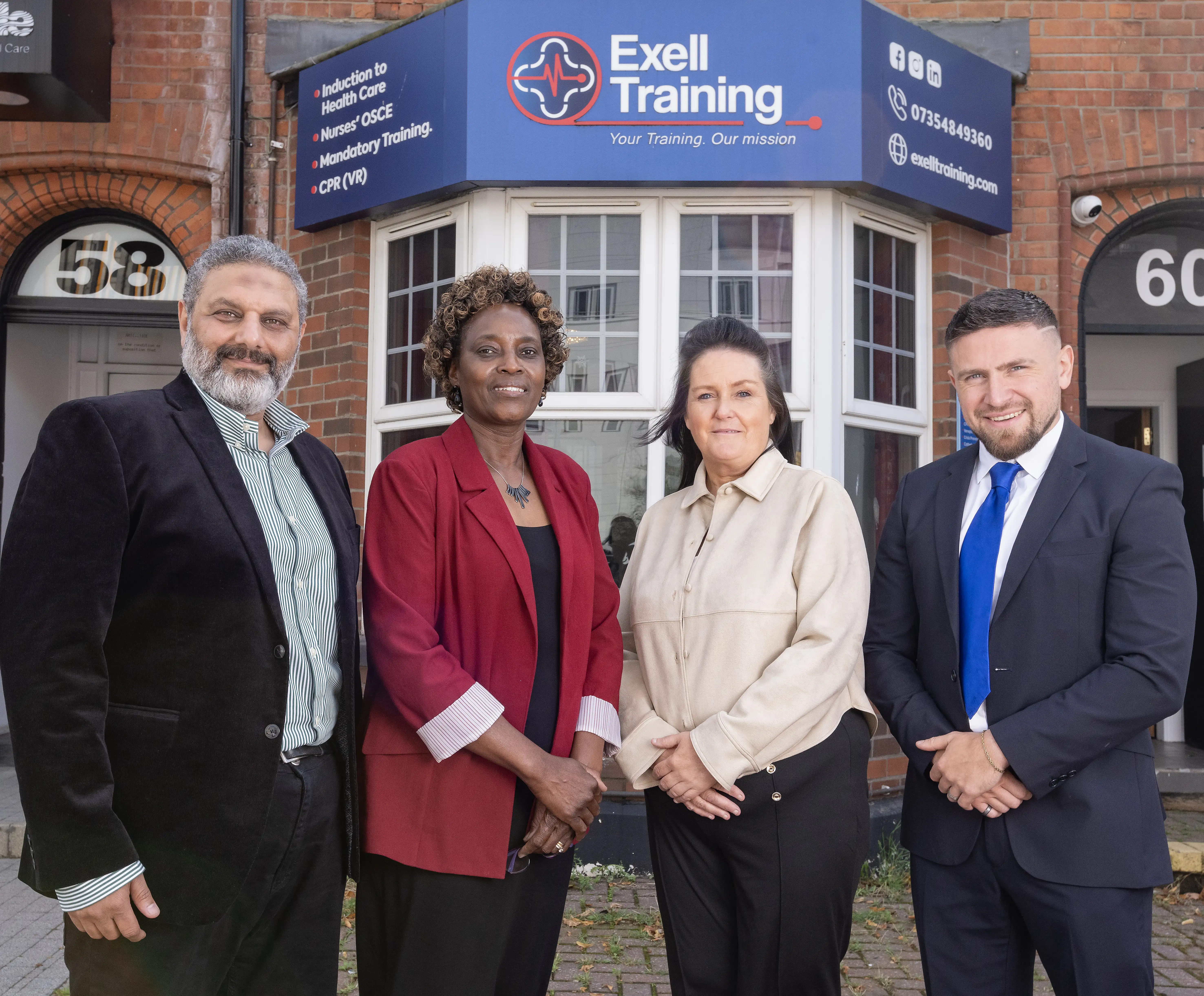 The Exell Training Team standing outside the training center