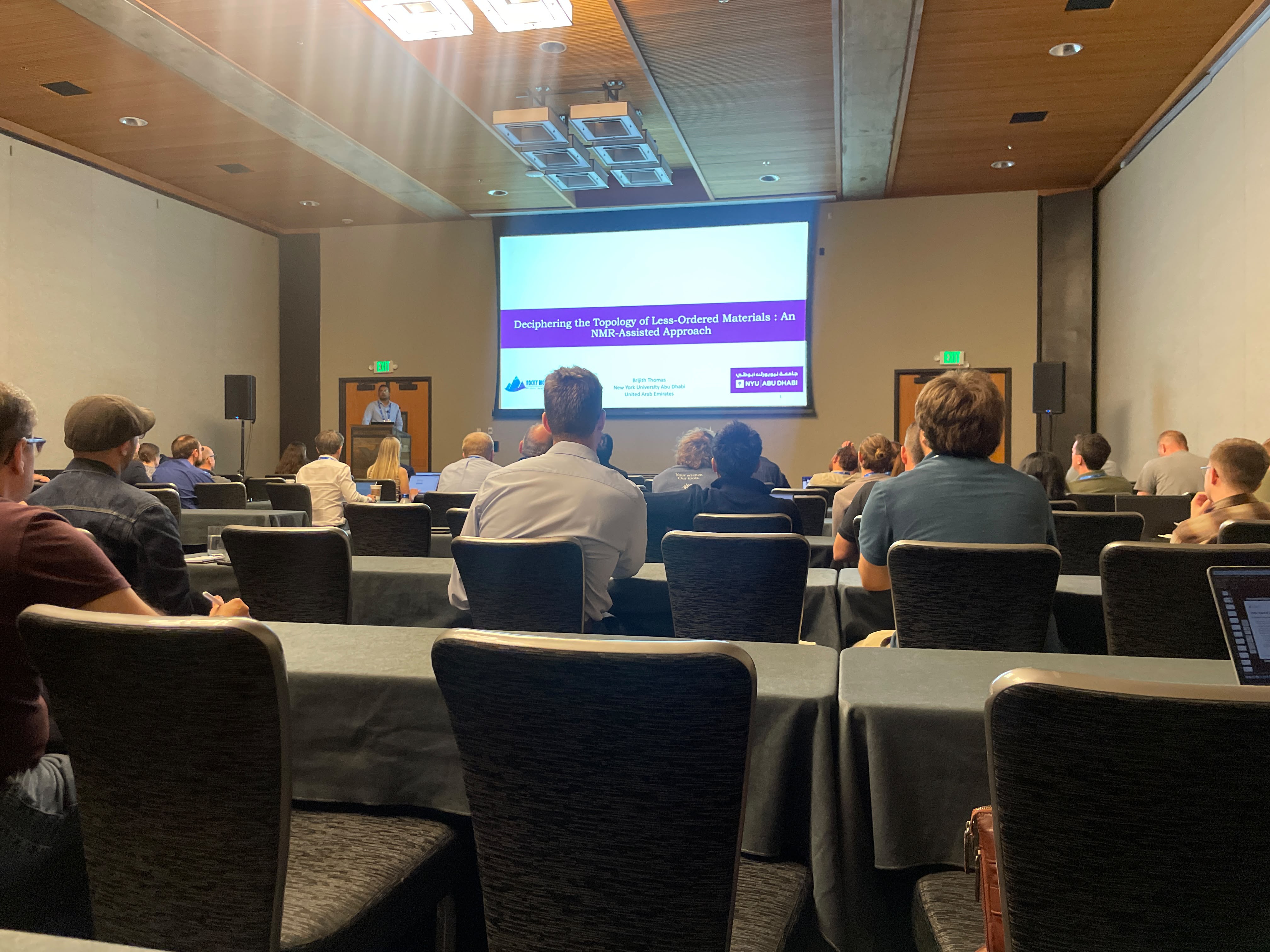 Brijith Thomas presenting at the 2026 Rocky Mountain Conference on Magnetic Resonance in Snowbird, Utah, on solid-state NMR approaches for less-ordered materials.