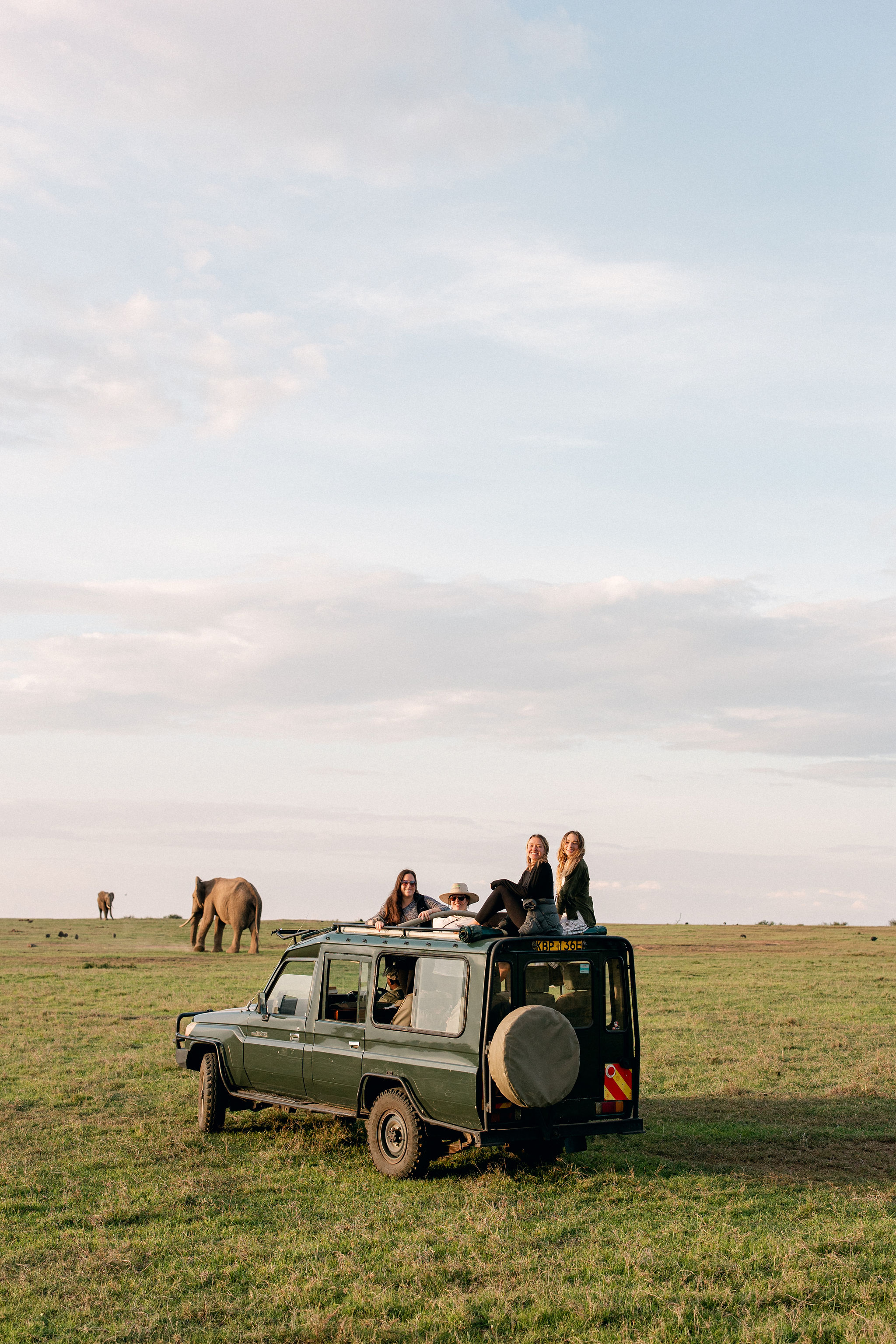 girls on game drive in kenya, kenya safari retreat yoga wellness 2025