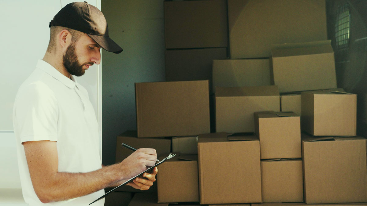 Worker organizing boxes