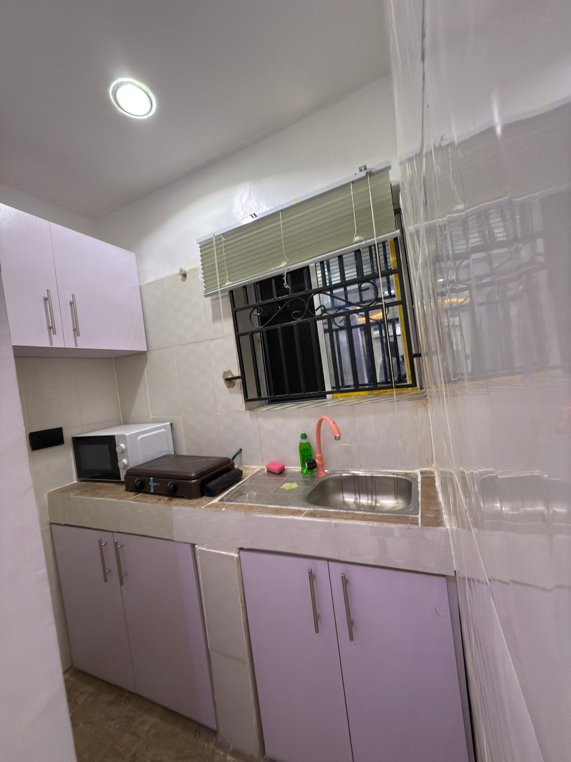 Spacious bedroom interior at Cedar The Crest, modern shortlet apartment in Yaba, Lagos