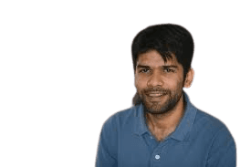 woman in blue denim jacket and white skirt standing beside brown wooden table
